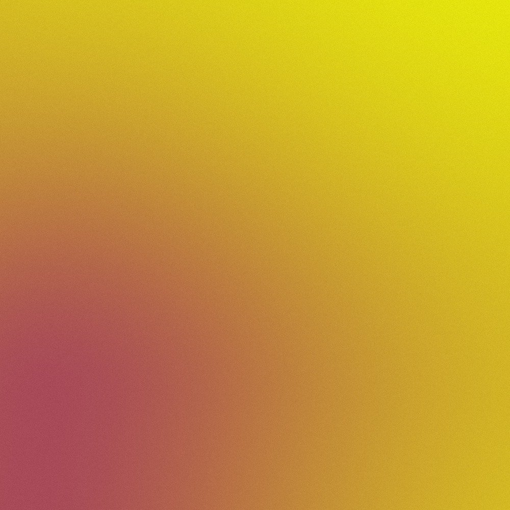 Blurred colorful gradient with shades of yellow, pink, and brown.