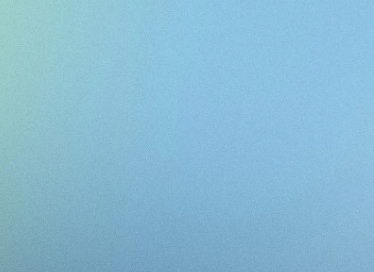 Close-up of a smooth, gradient-colored surface with shades of blue and green.