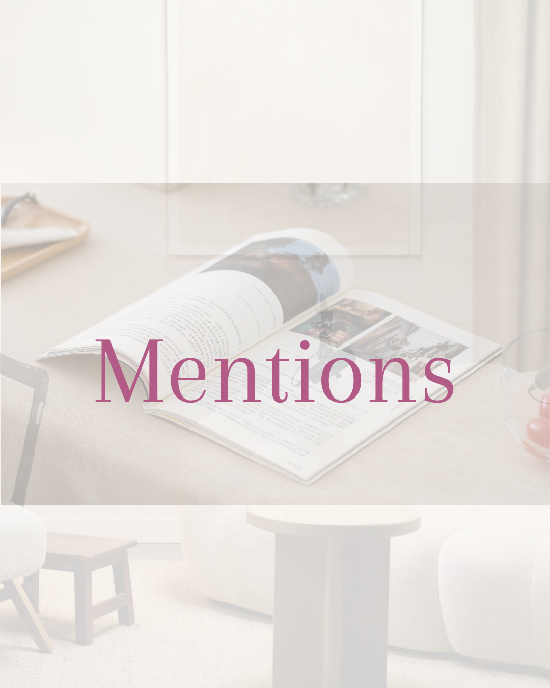 Open magazine on a table with the word "Mentions" written across it in purple text.