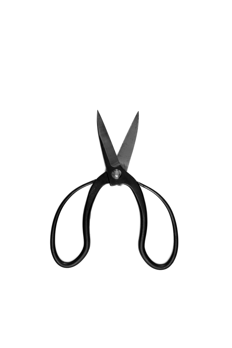 Black-handled scissors with partially open blades on a black and gray background.