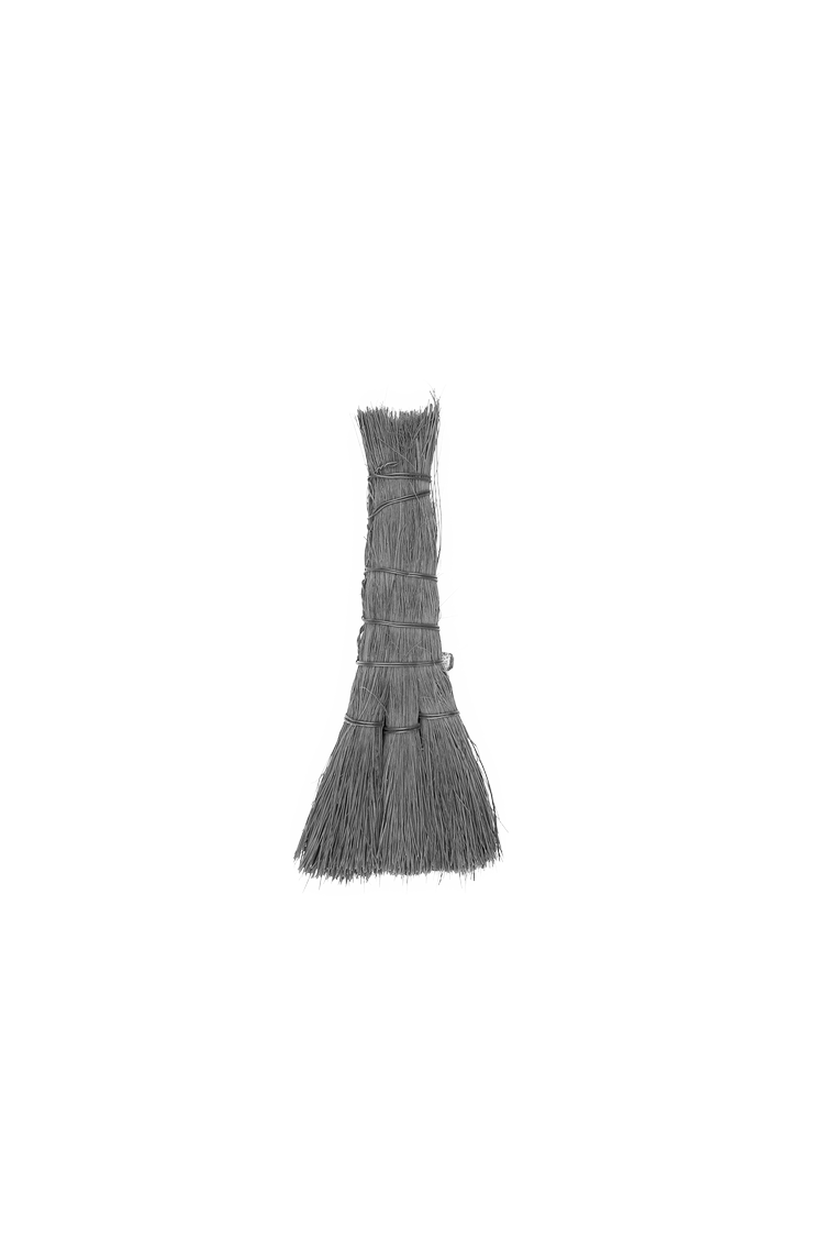 A black and white image of a small bundle of straw bristles.