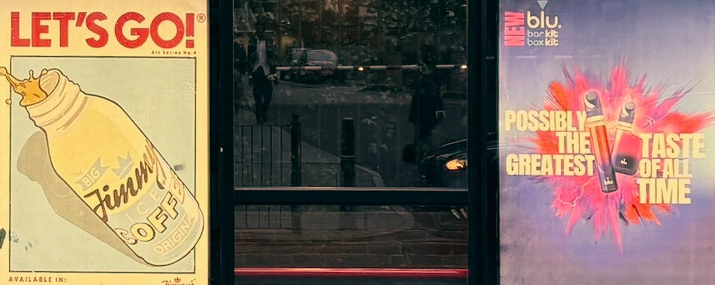 Posters on a glass window, one advertising Big Jim's coffee with a drawing of a coffee cup, and the other with an energetic design featuring lightning and a flavor burst, promoting a product as possibly the greatest taste of all time.