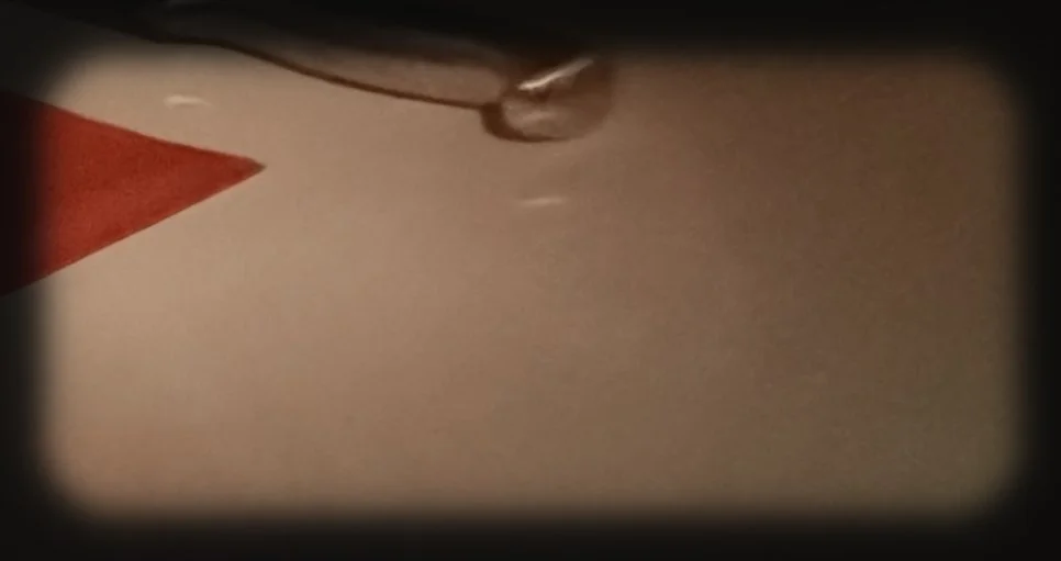Close-up of an airplane wing with a red tip viewed from the window during a flight