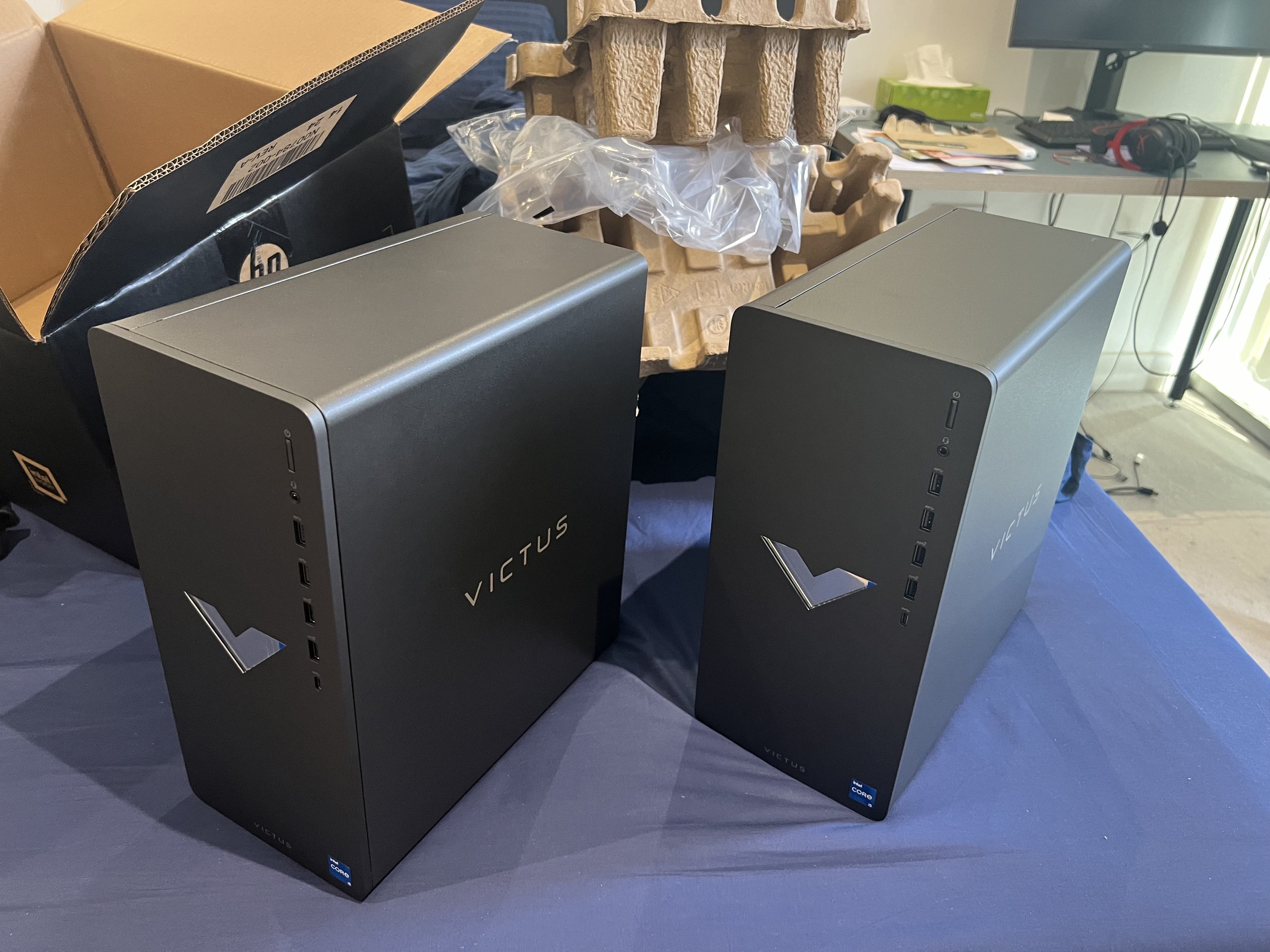 Two desktop computers with black cases and 
