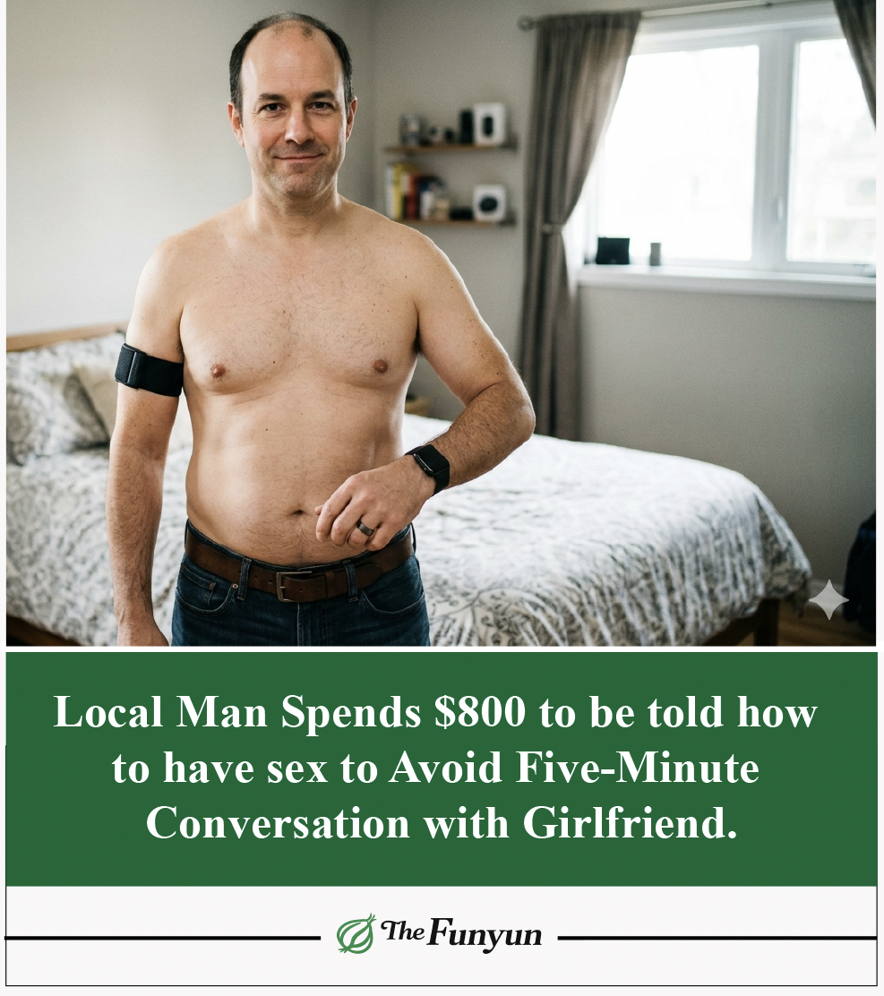 A man standing in a bedroom showing off his Apple Watch, Oura Ring and Peak-Pro armband