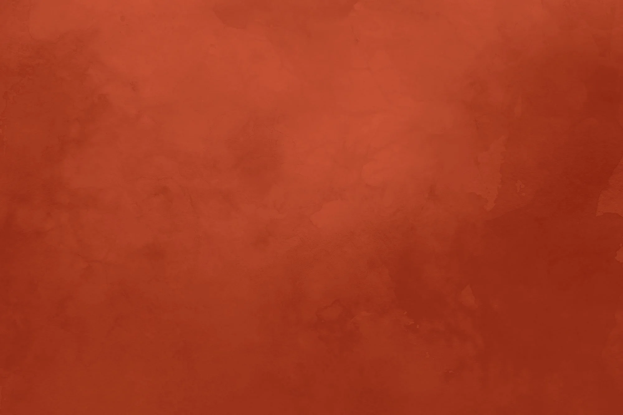 A blurry, reddish-orange textured surface.
