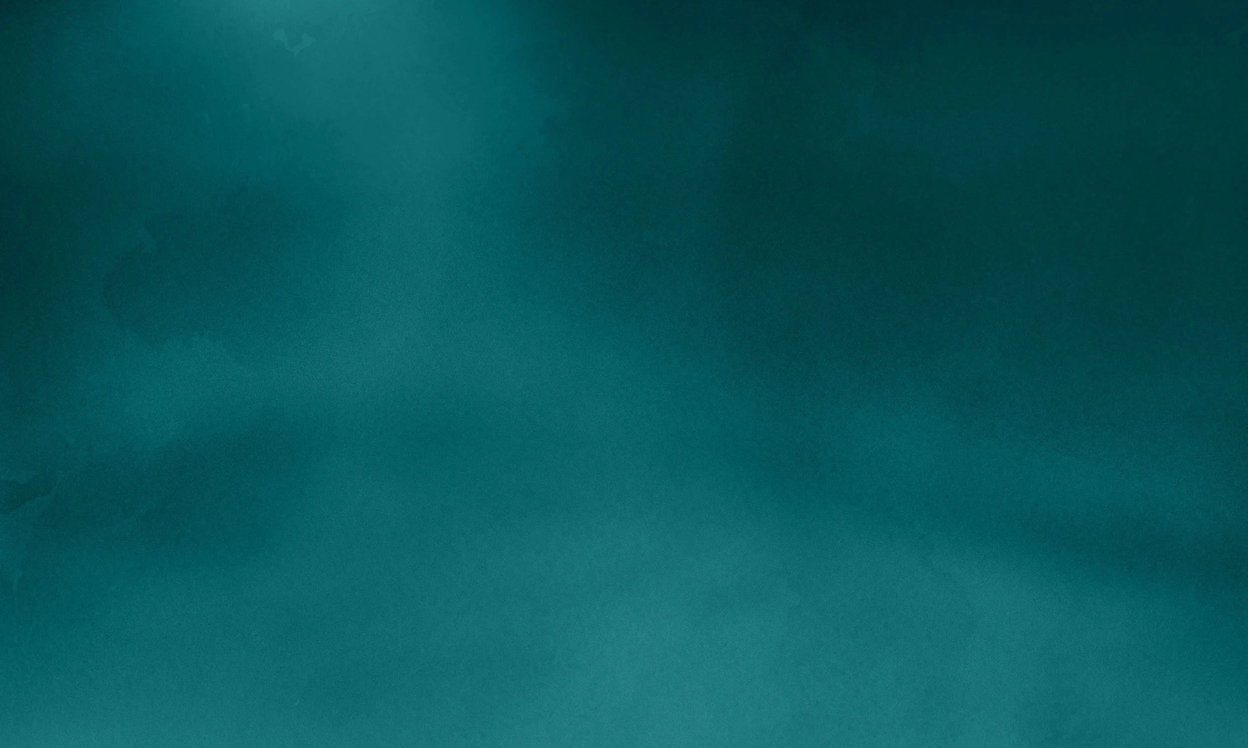 A plain, textured surface in shades of teal or blue-green.