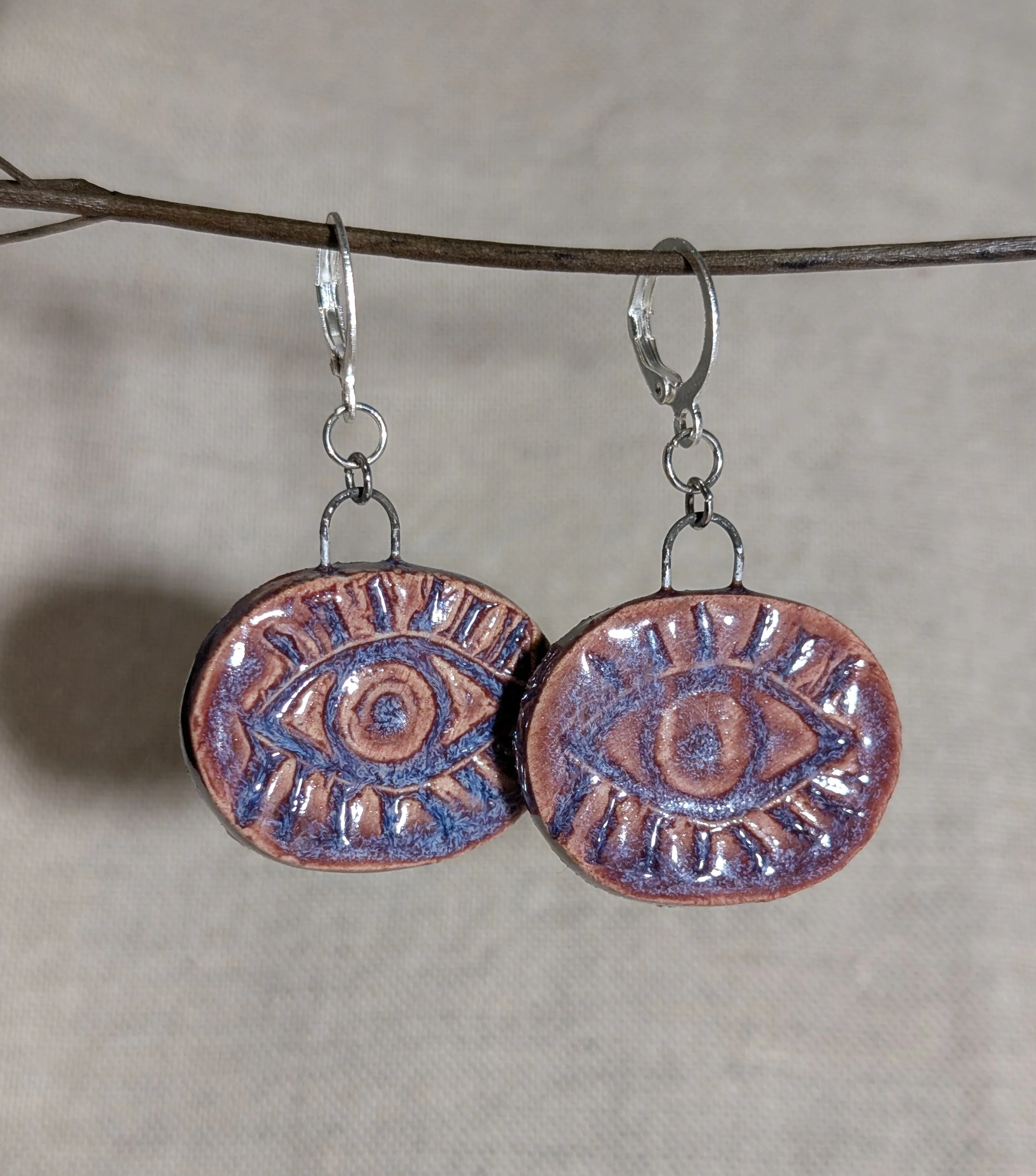 Boucles d'oreilles avec oeil gravé