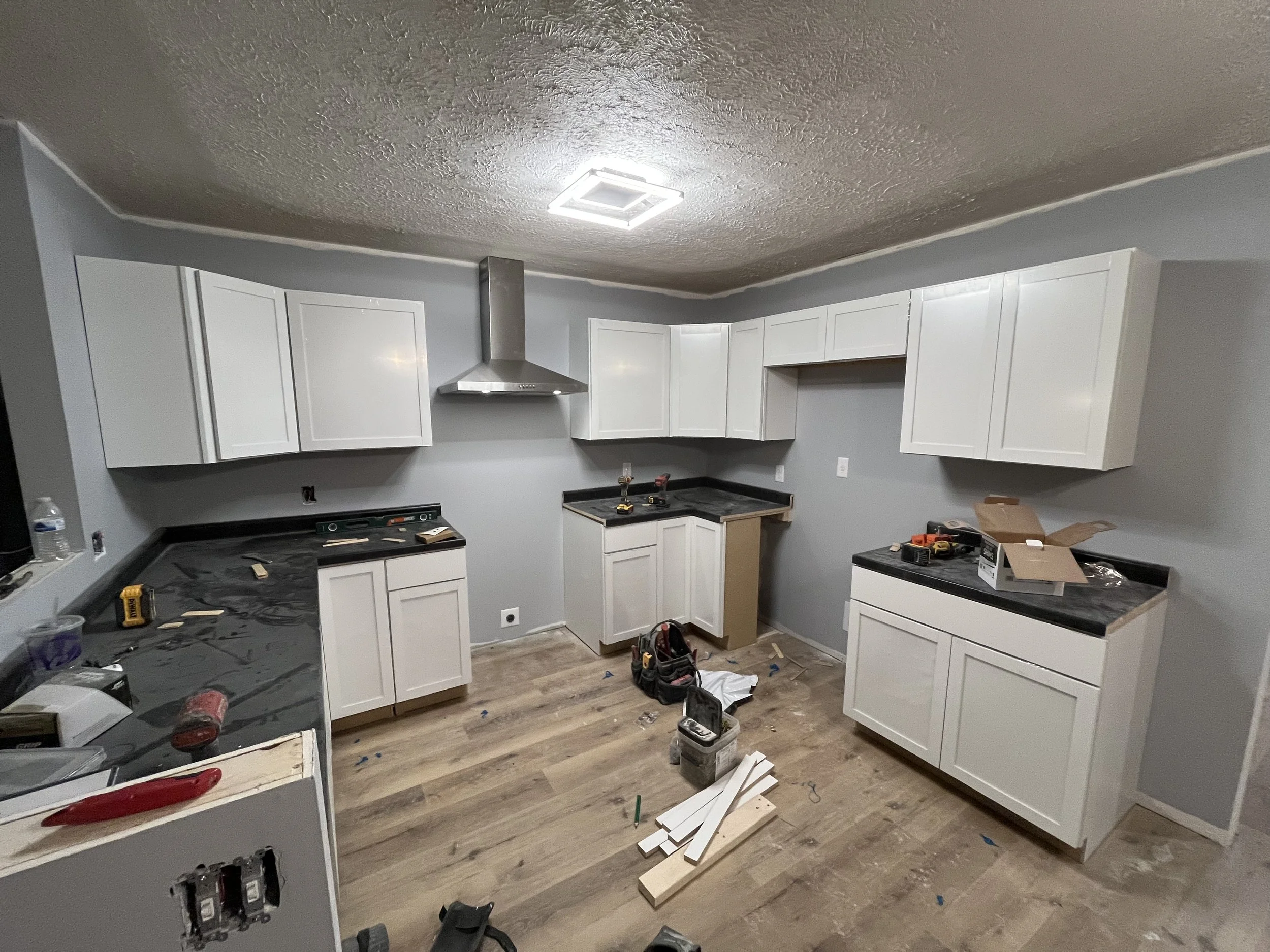 Kitchen cabinets finished and countertop installed.