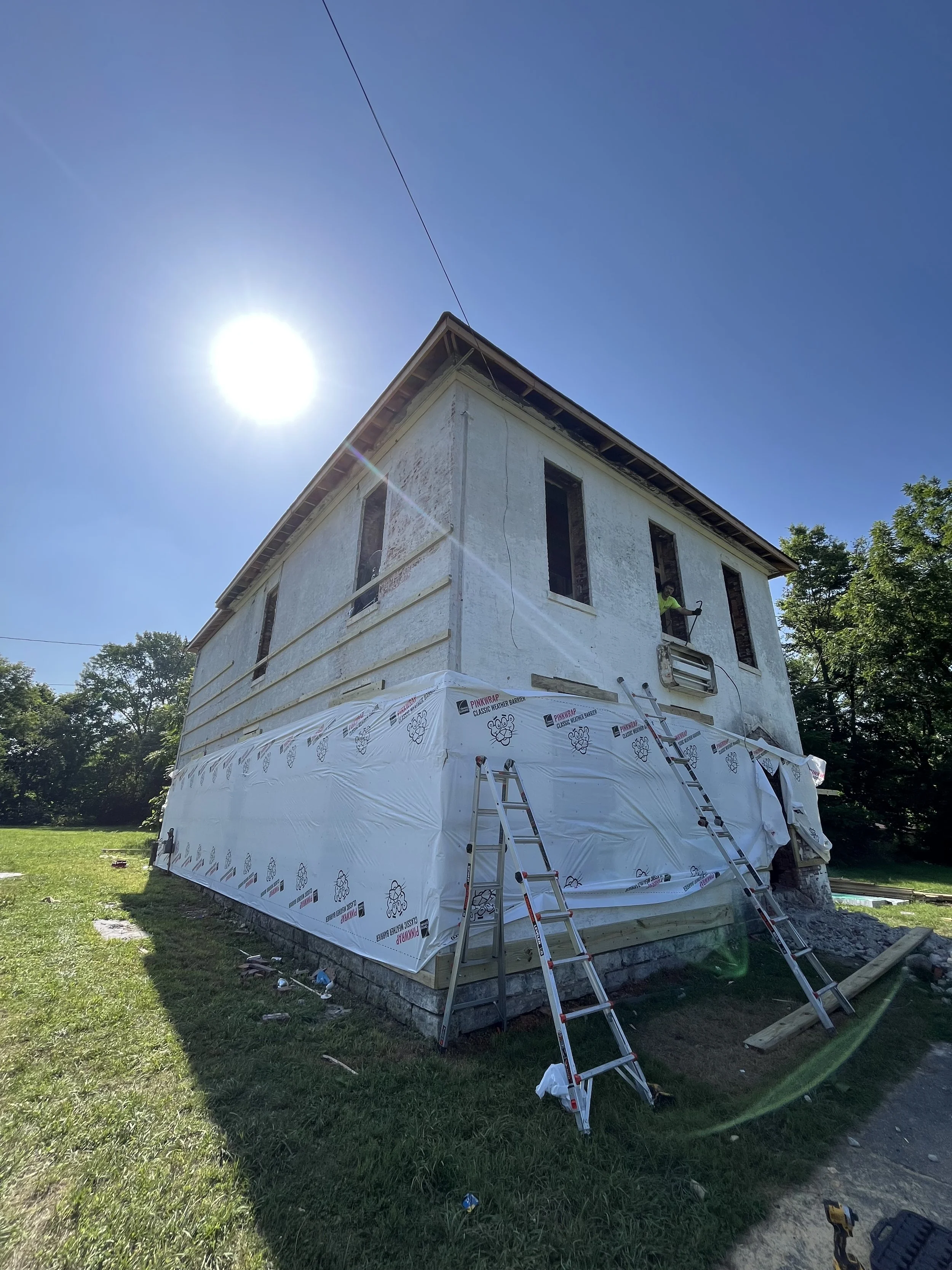 We started furring out the building for the new metal siding, windows, and doors.
