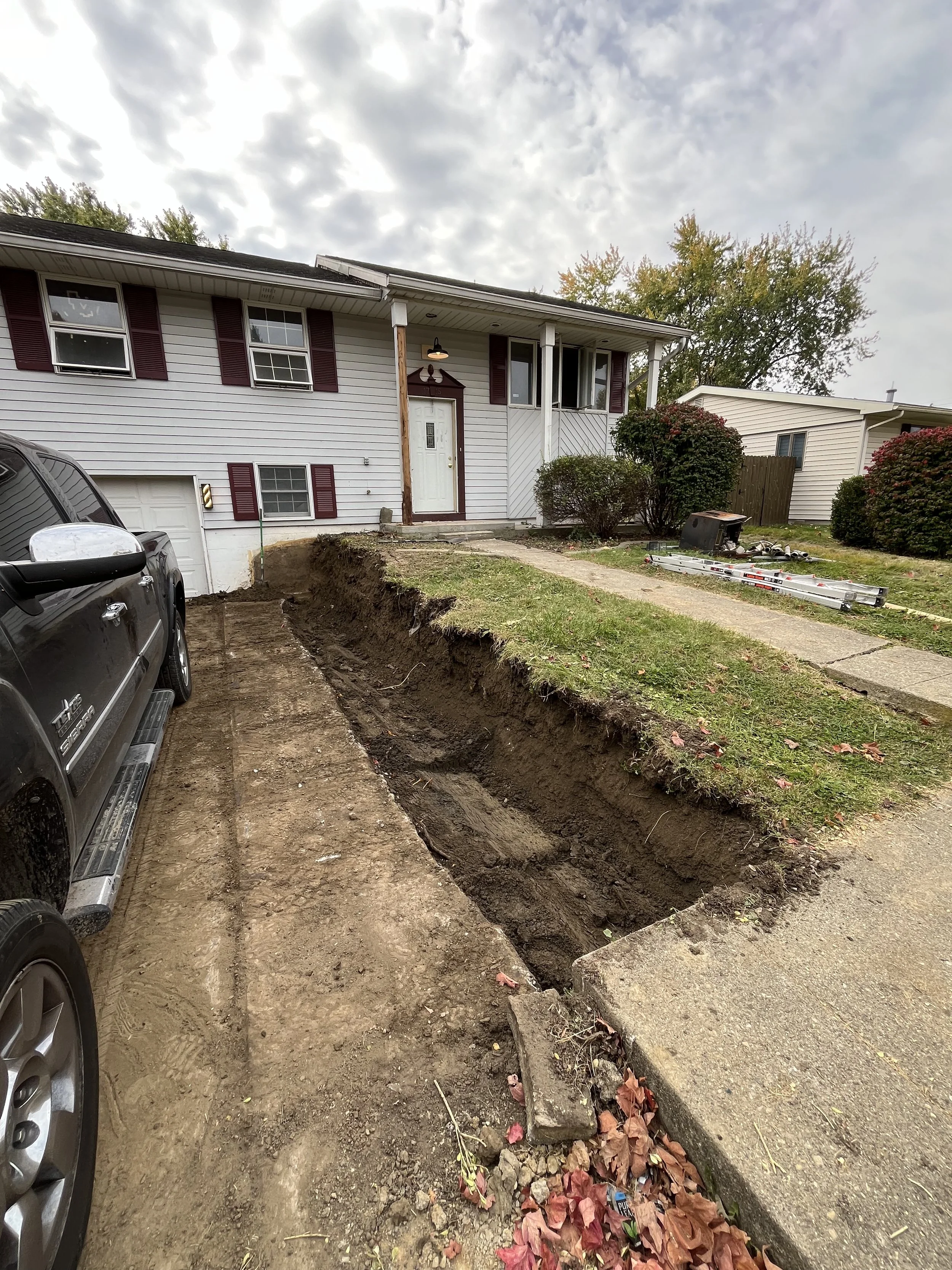 removal of old retaining wall, we had to cut back the soil to install new T-holds.