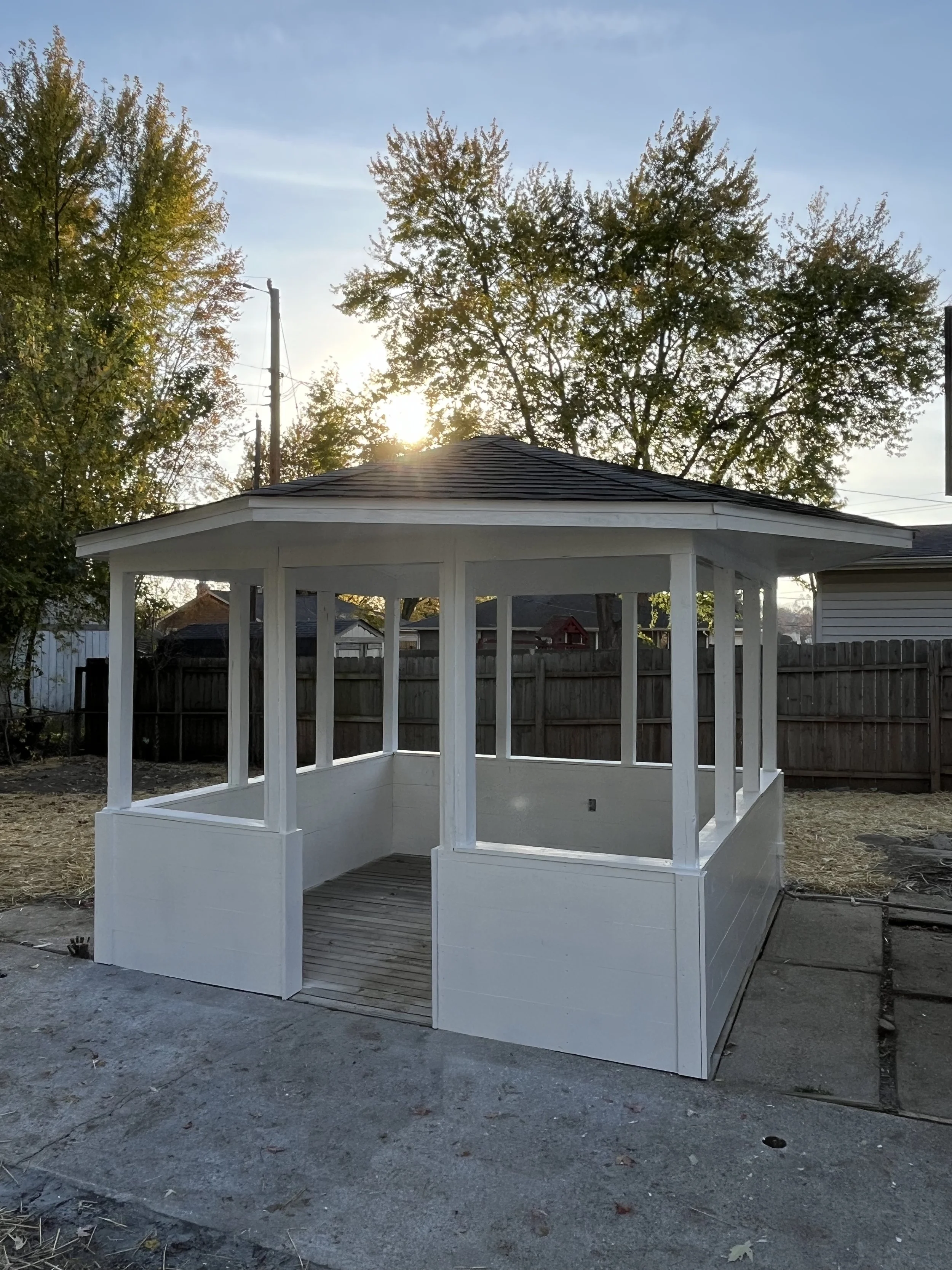 We replaced all the wood on the back gazebo and repainted it white, as well as redid all of the electrical. 