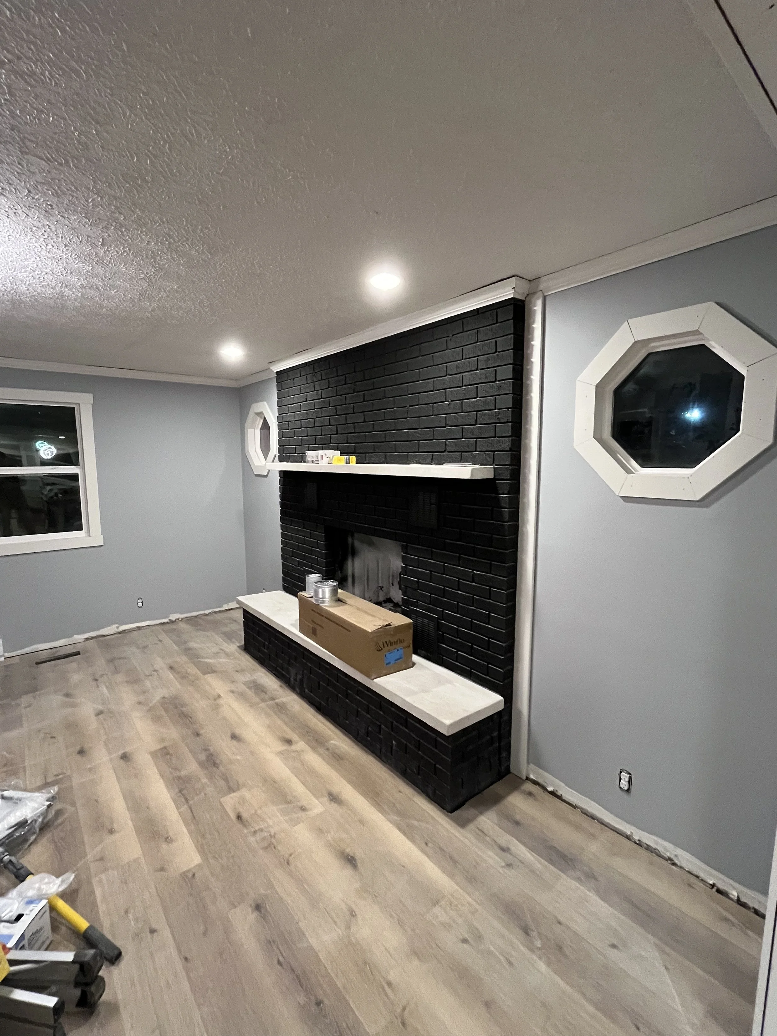 We painted the fire place black to make it pop as an accent piece, new LVP floors throughout the home.