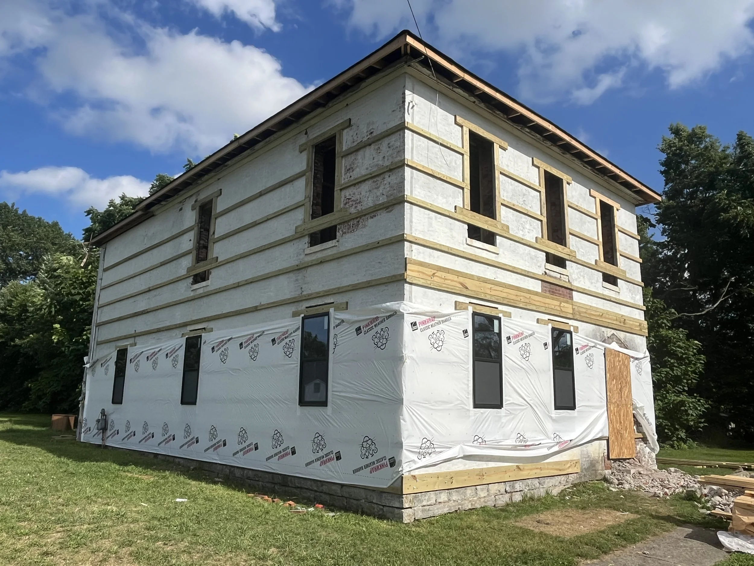 Moving back to the exterior, we installed the new first floor windows. 