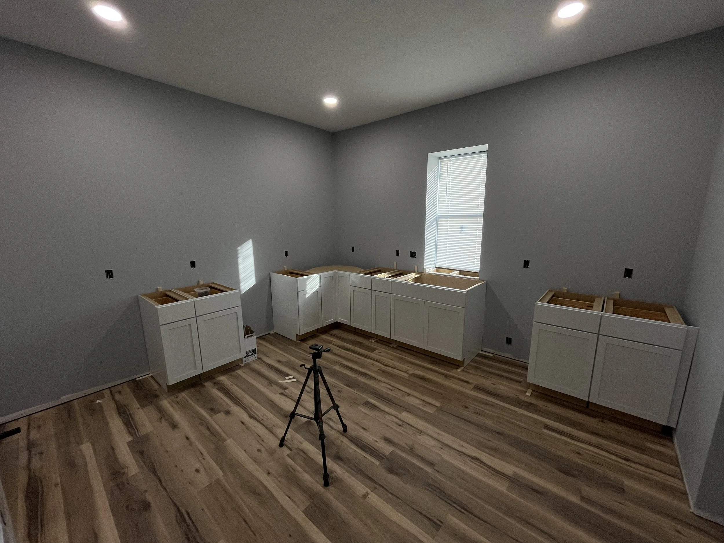 Kitchen cabinets getting installed. 