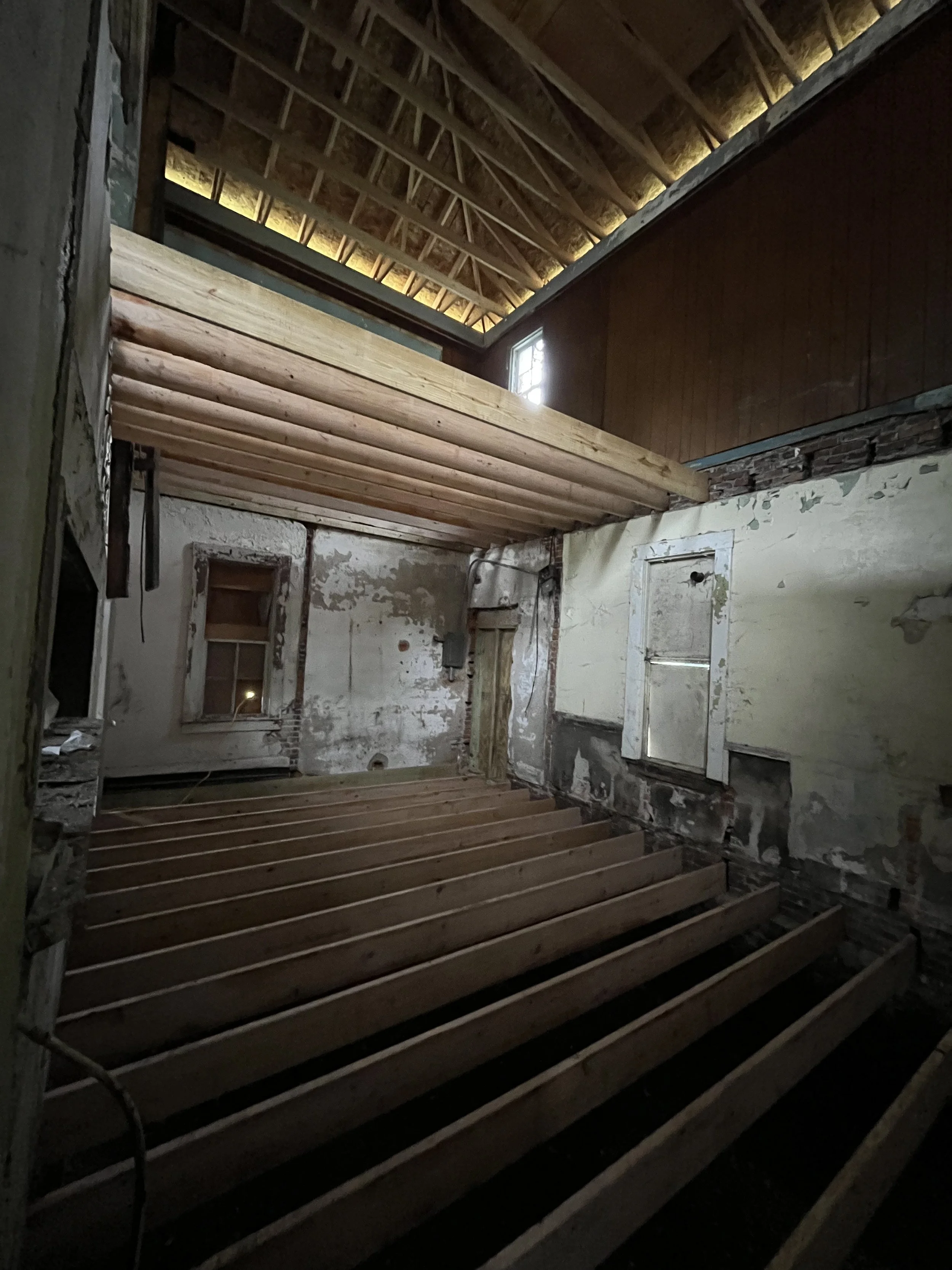 First floor joists installed, second floor started.