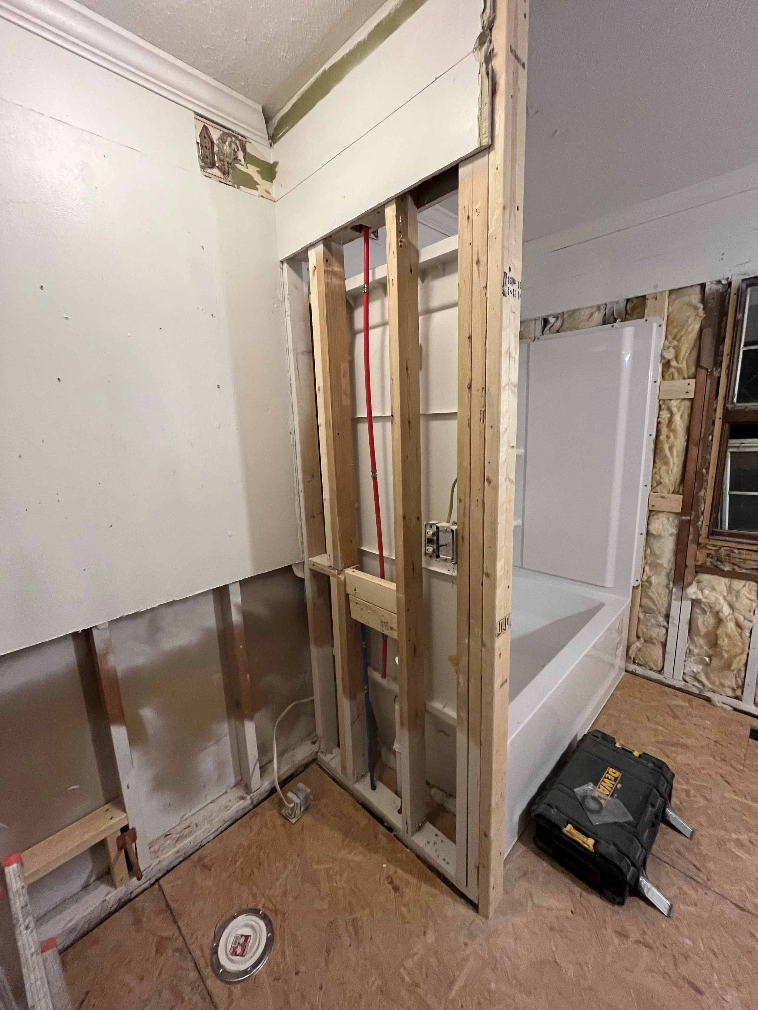Subfloor installed throughout the house, new tub/shower stall installed. 