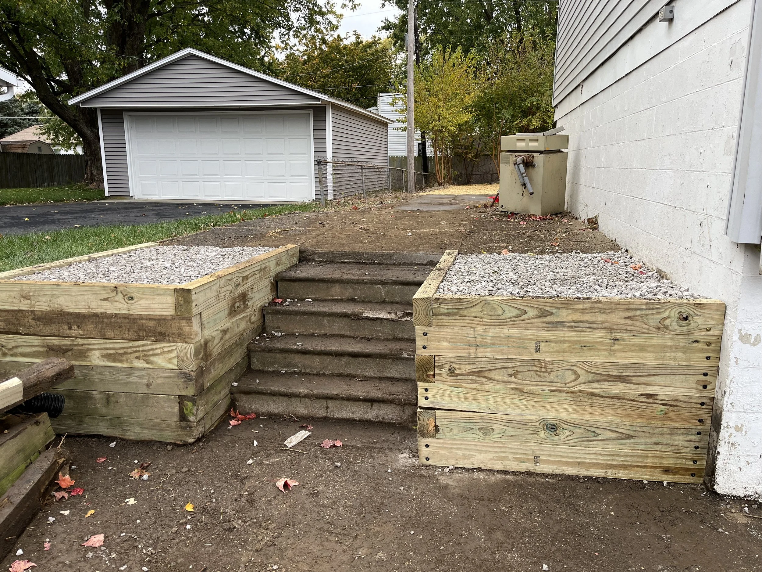 We also ended up replacing the two left side square garden box's to match.