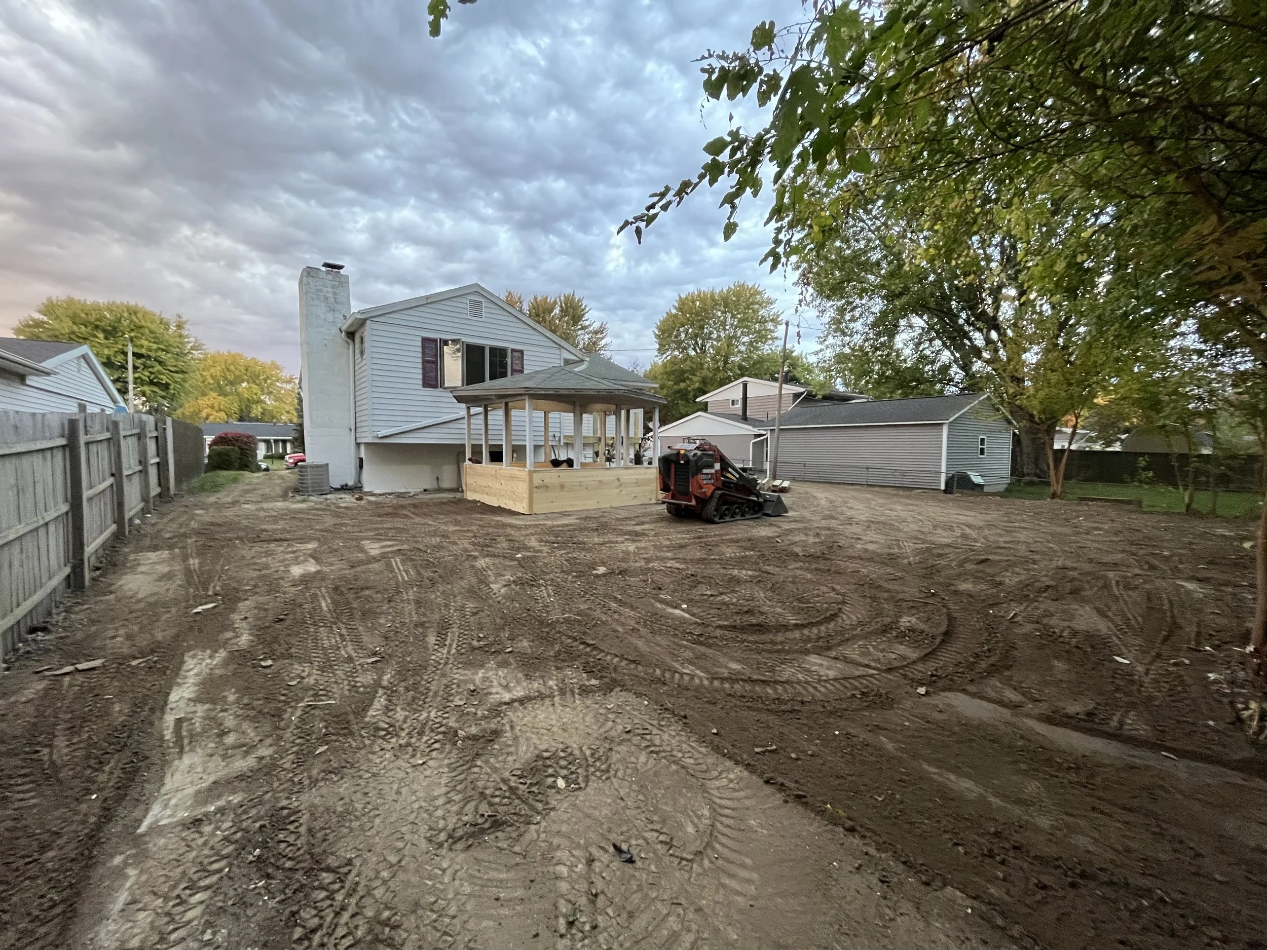 Back yard completely graded out, roughly 44tons of top-soil brought in.