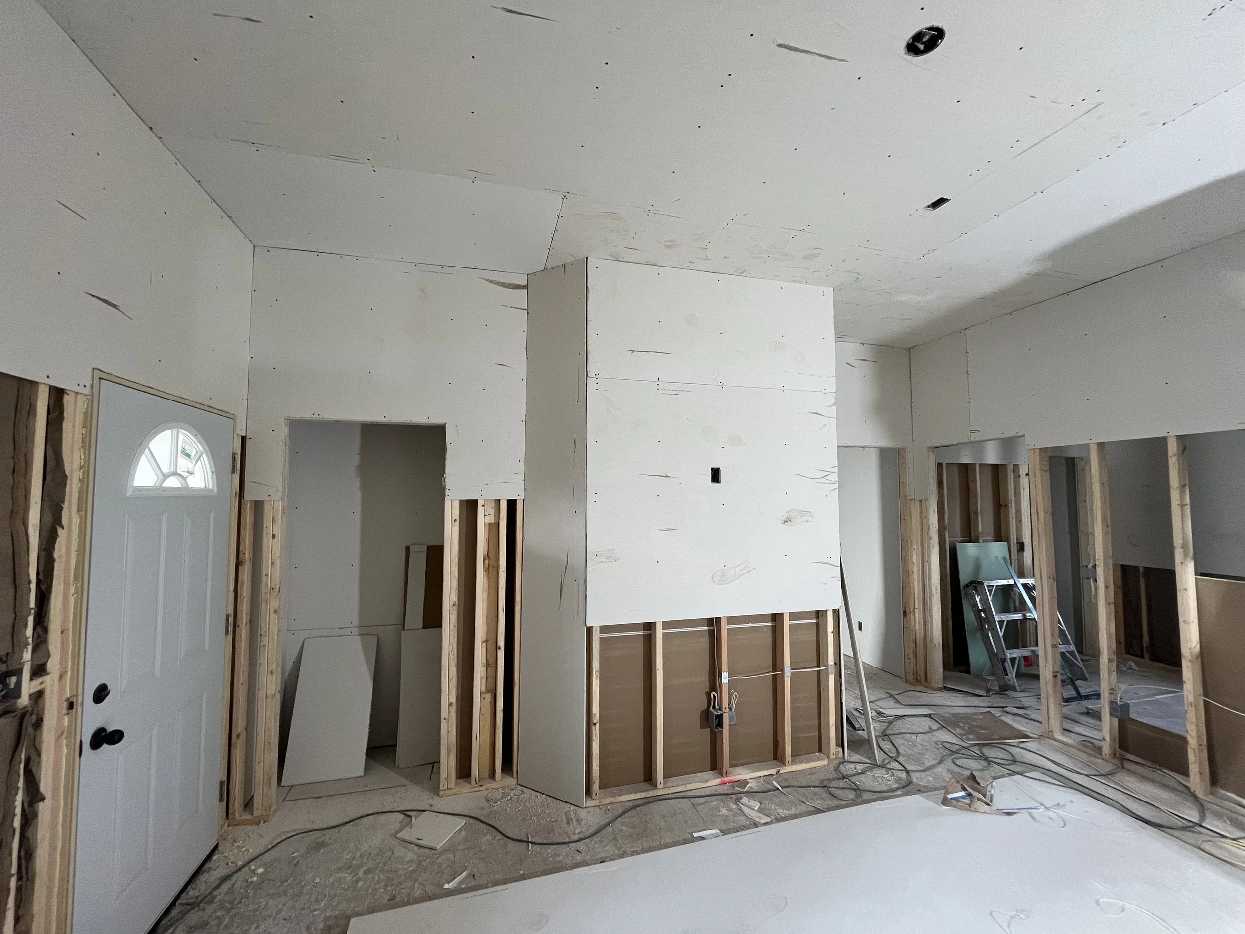First floor drywall starting to go up after the rough in stage is completed. 