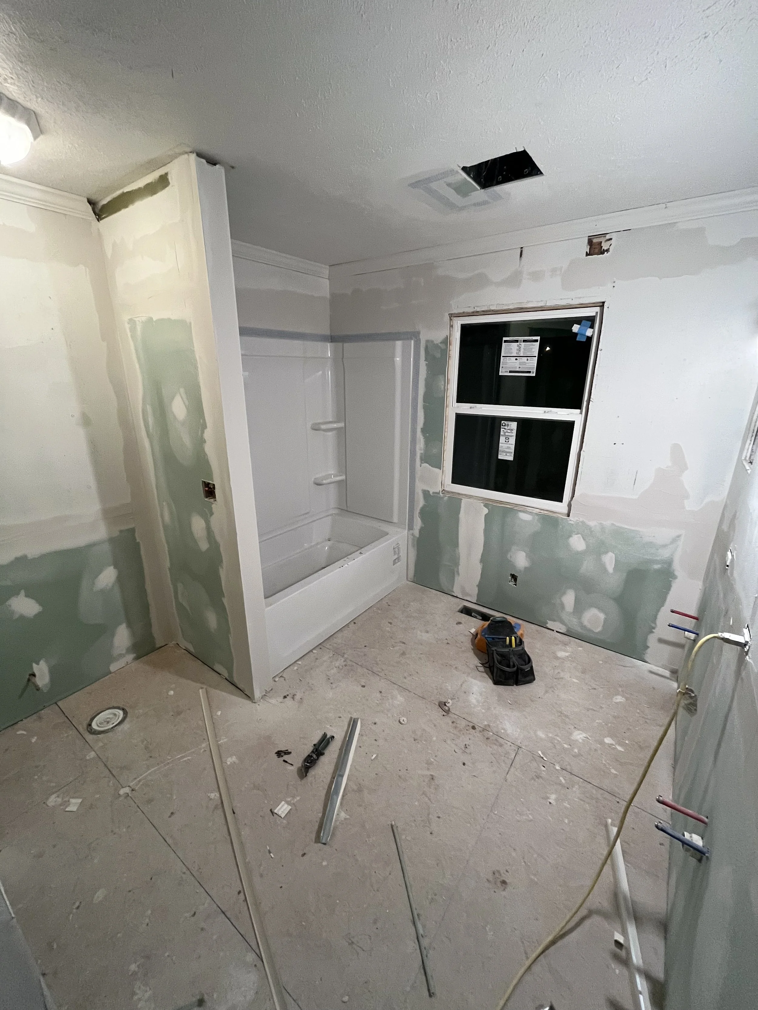 Drywall hung, first coat of mud/tapped.