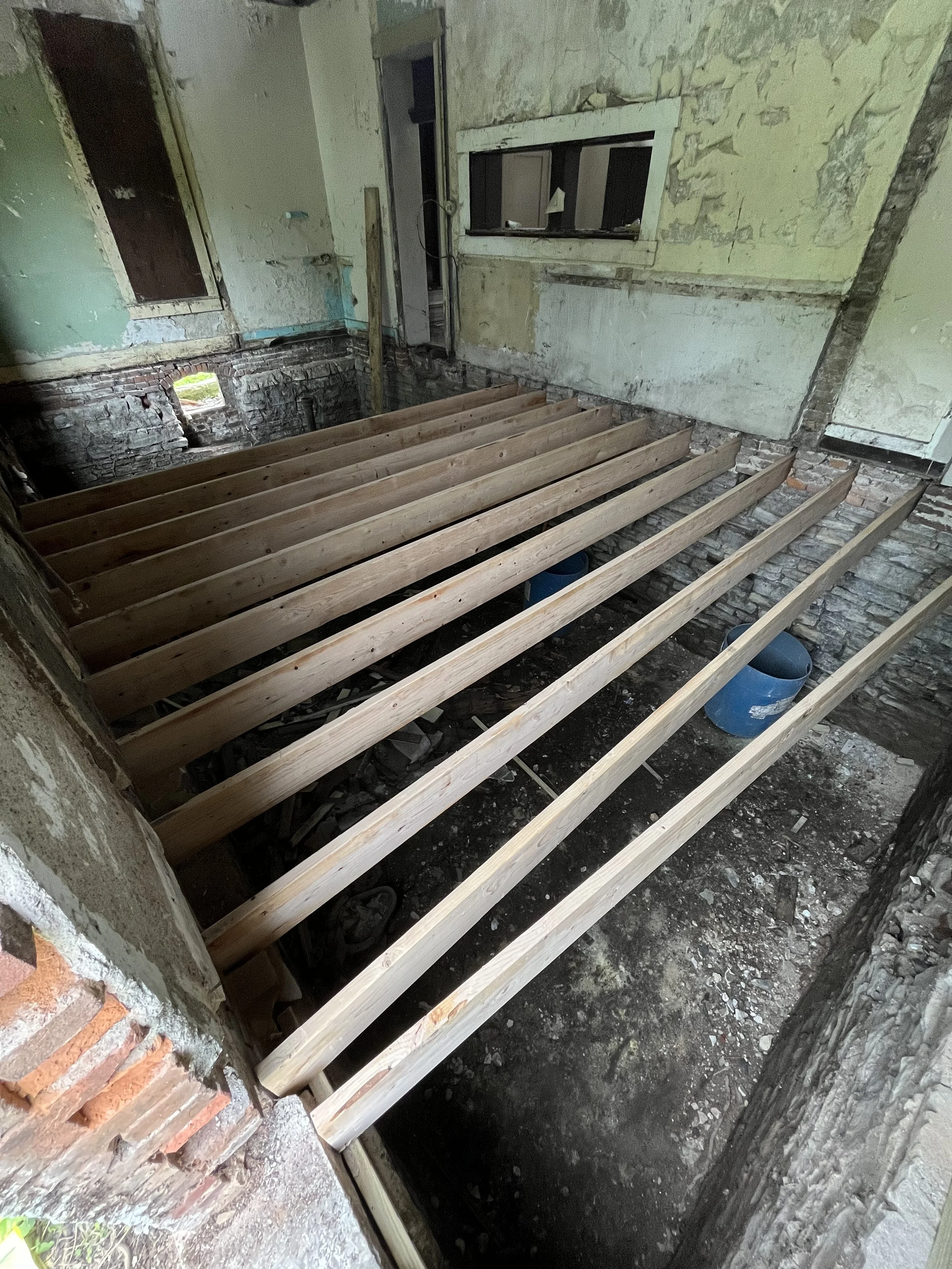 New floor joists going in after basement was cleaned out.