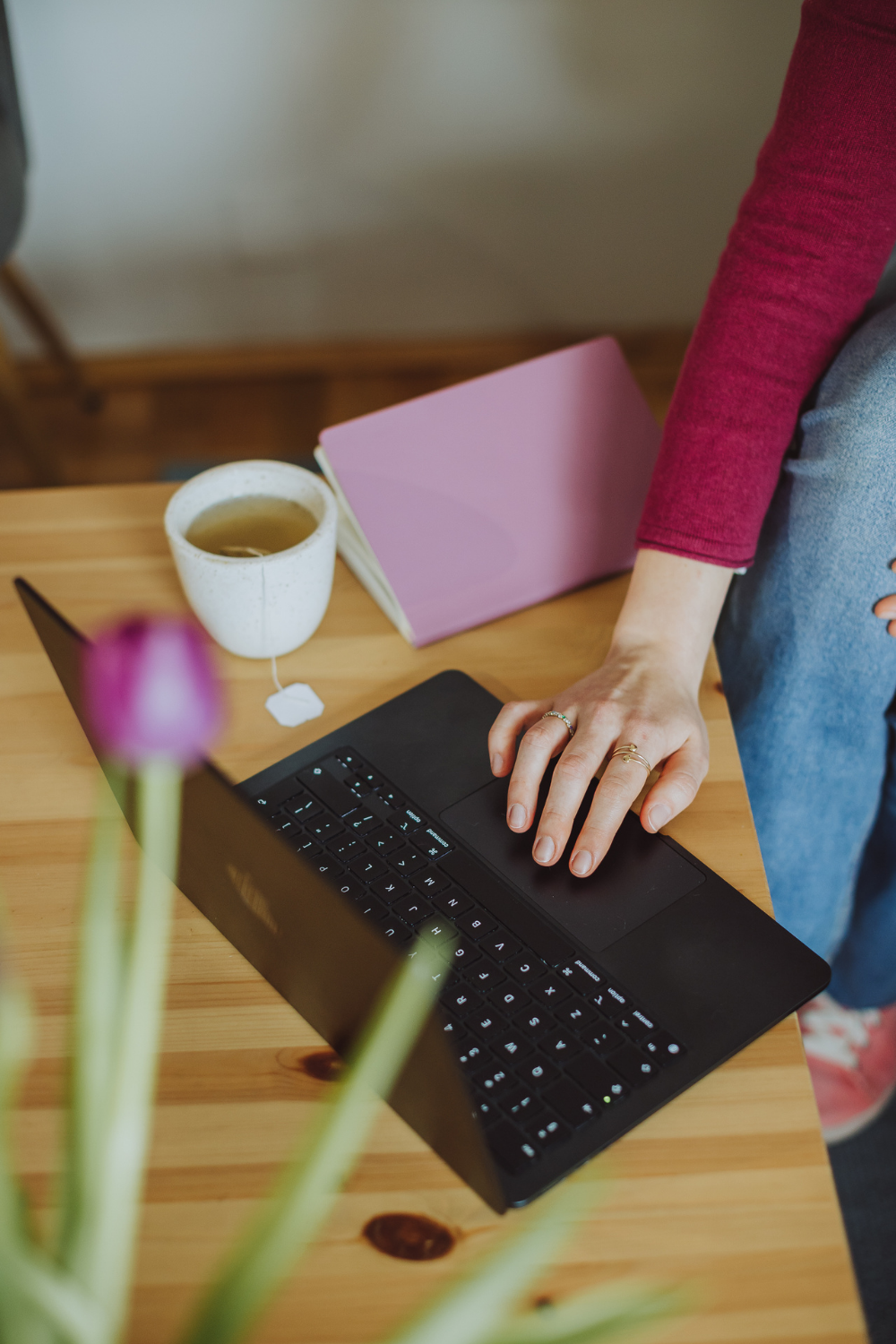 copy-corner-write-copy-that-sounds-like-you-even-with-AI-working-on-a-laptop-next-to-notebook-and-tea-at-a-desk