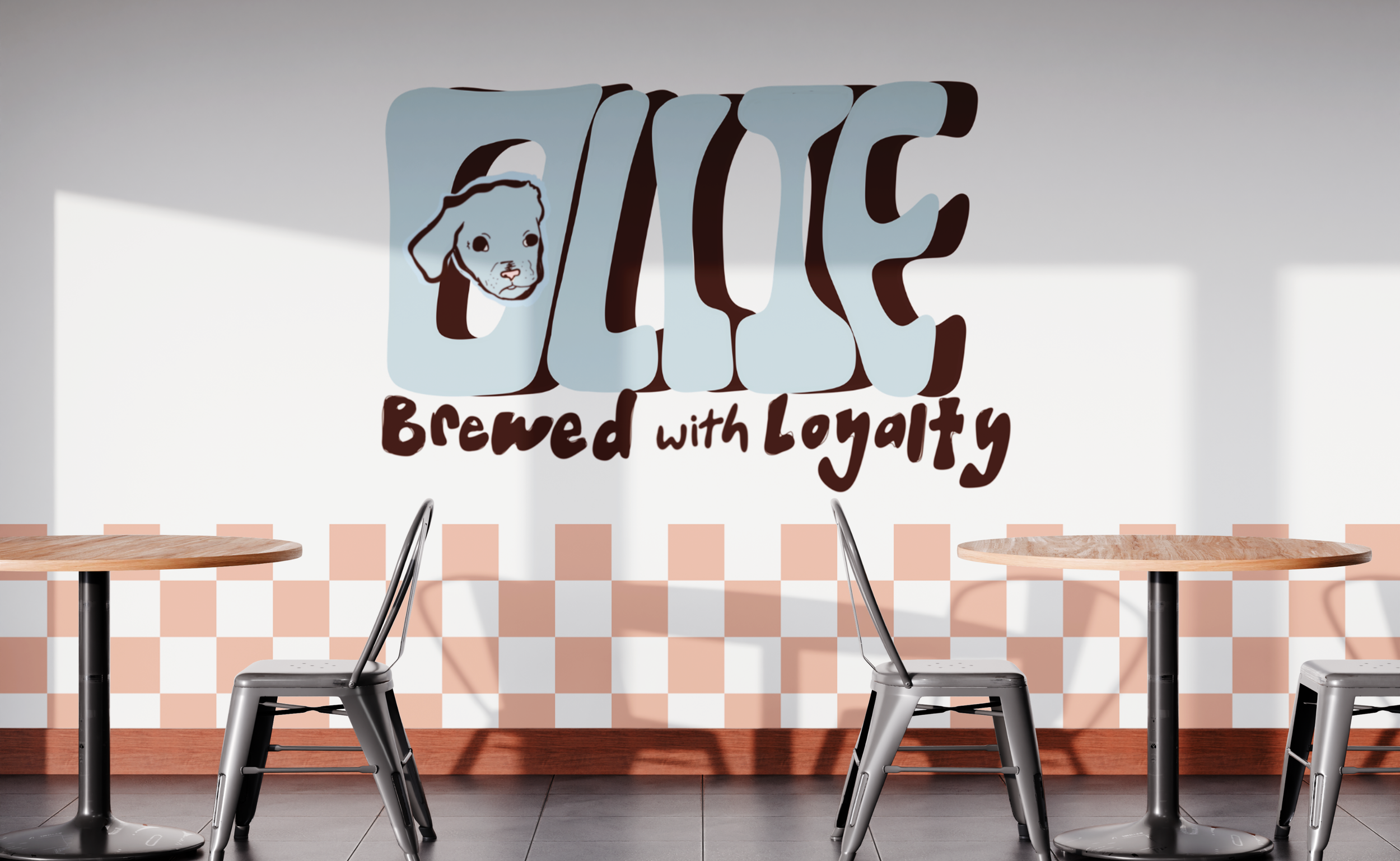 Interior of a cafe with a wall sign that says "LOVE brewed with Loyalty". The sign features a dog's face inside the letter "O" in "LOVE". There are wooden tables and metal chairs in front of the wall.