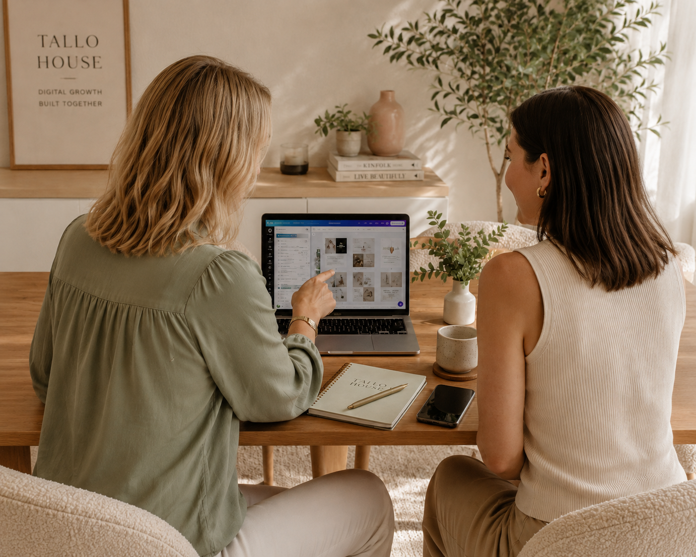 Two women reviewing a social media content plan on a laptop during an in-house social media training session — Tallo House delivers face-to-face social media training for businesses on the Sunshine Coast and Bundaberg.