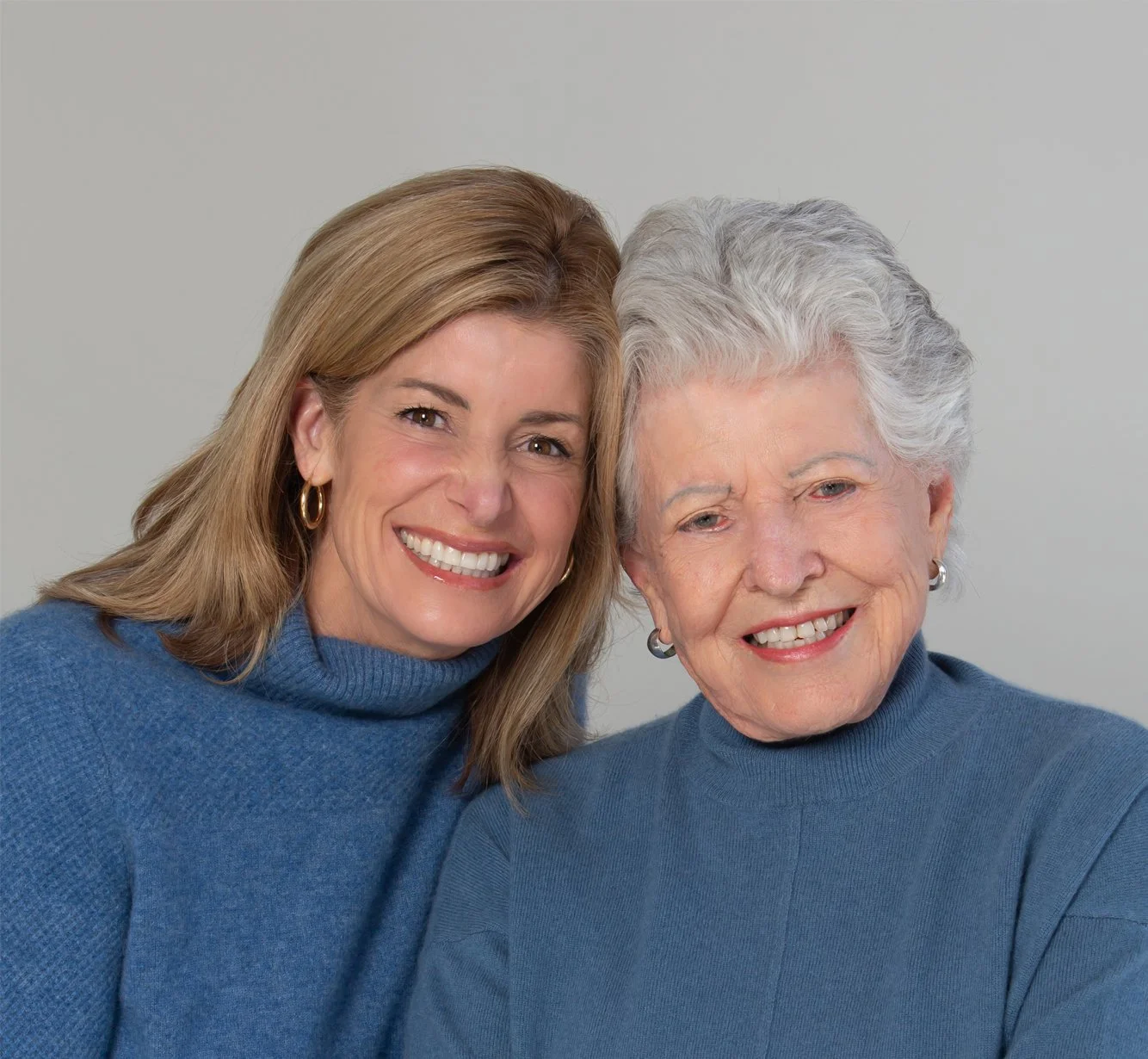 Dr. Kerry Burnight smiling with her mother, both wearing blue