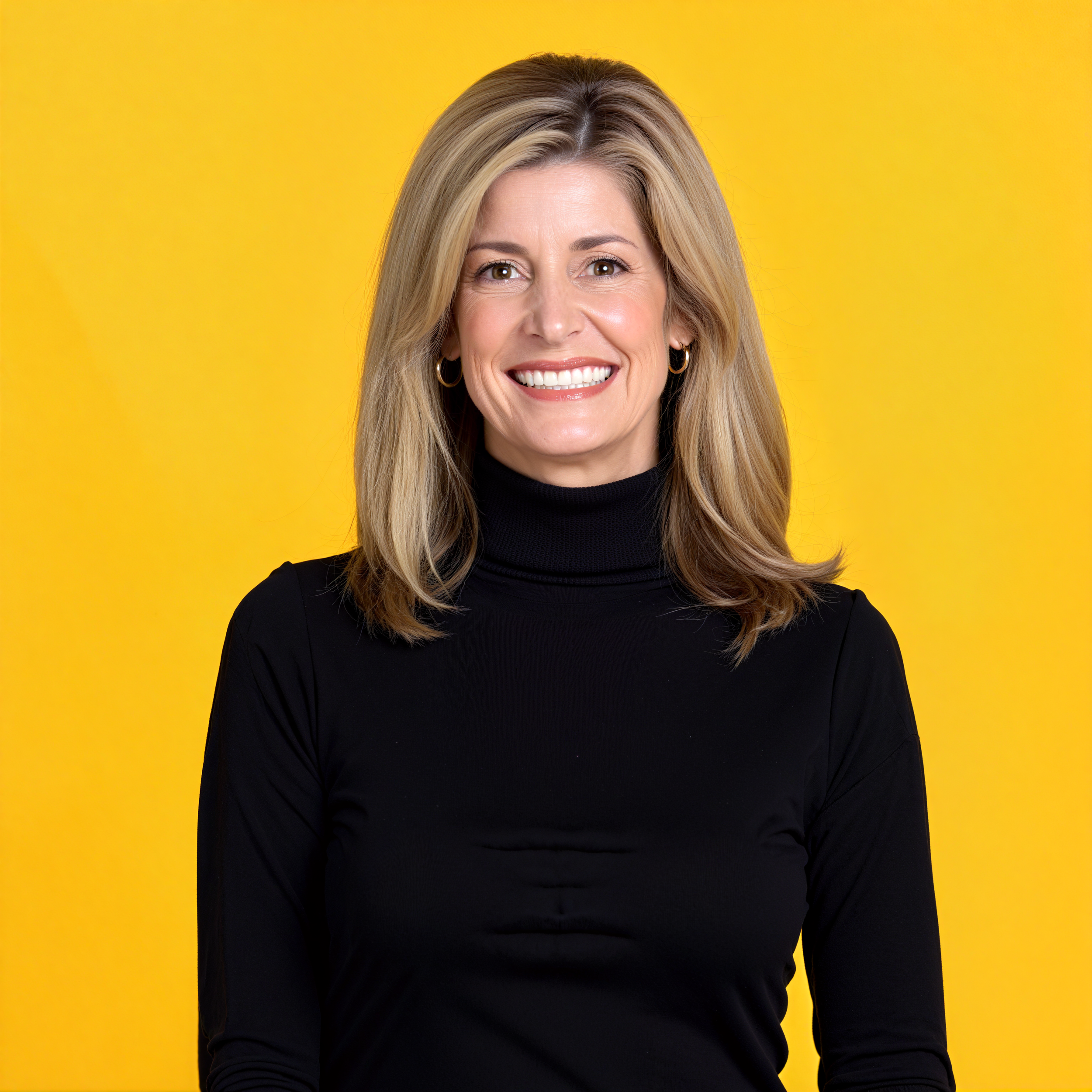 Dr. Kerry Burnight smiling against a yellow background