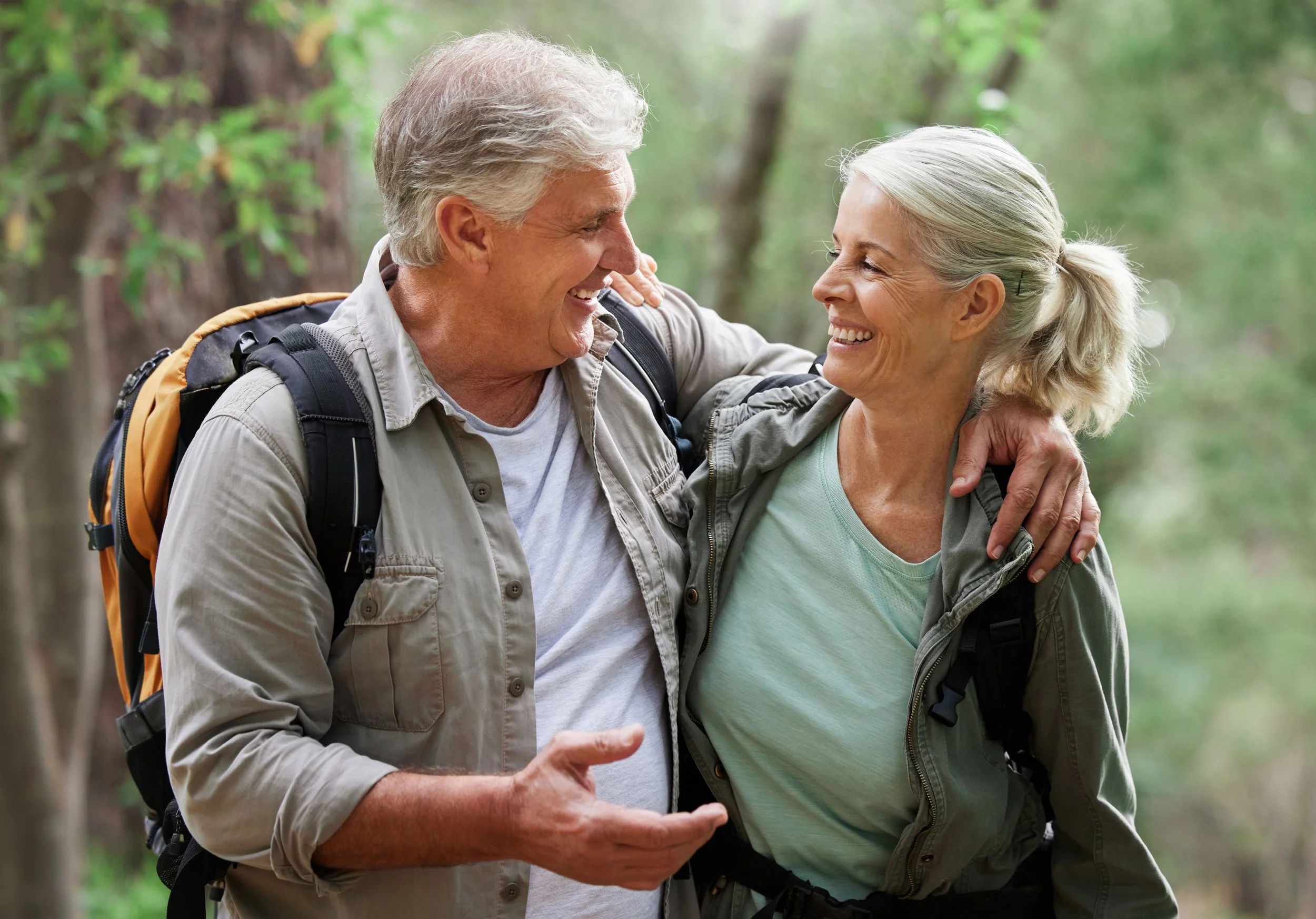 An active and happy elderly couple hiking.