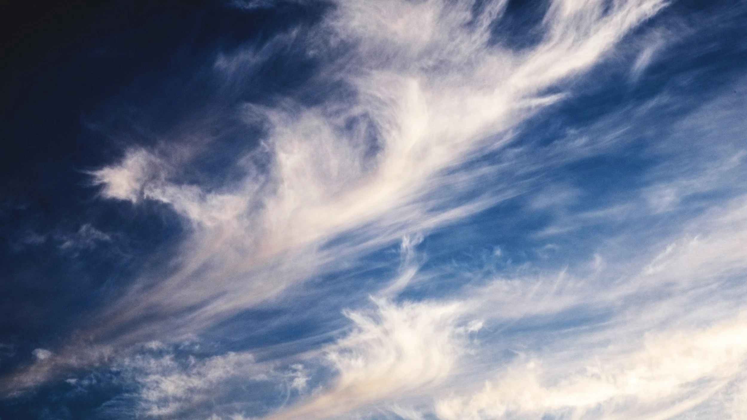 Sky with scattered clouds.