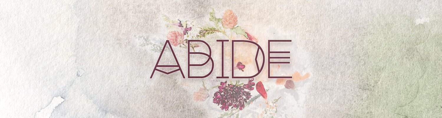 Watercolor background with floral design and the word 'ABIDE' in large letters.