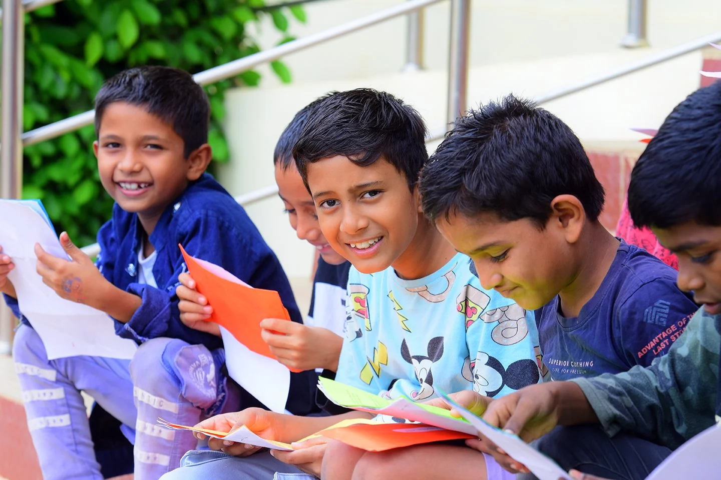 Boys reading letters