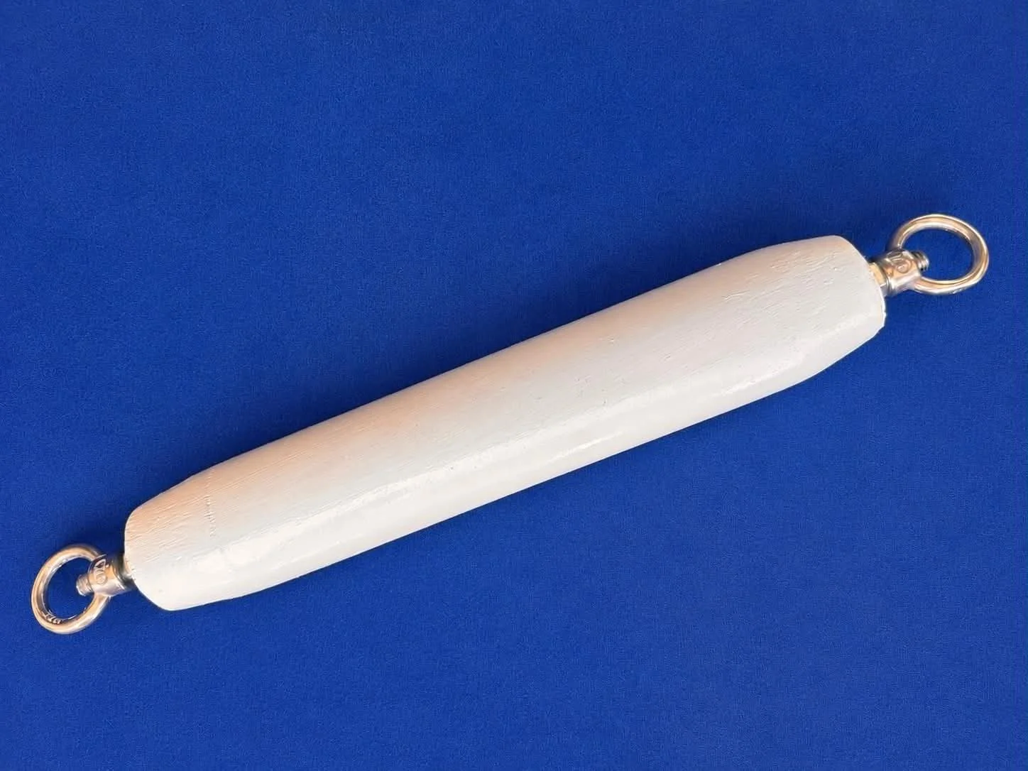 Mandrel, made by JZMandrels, against a blue background