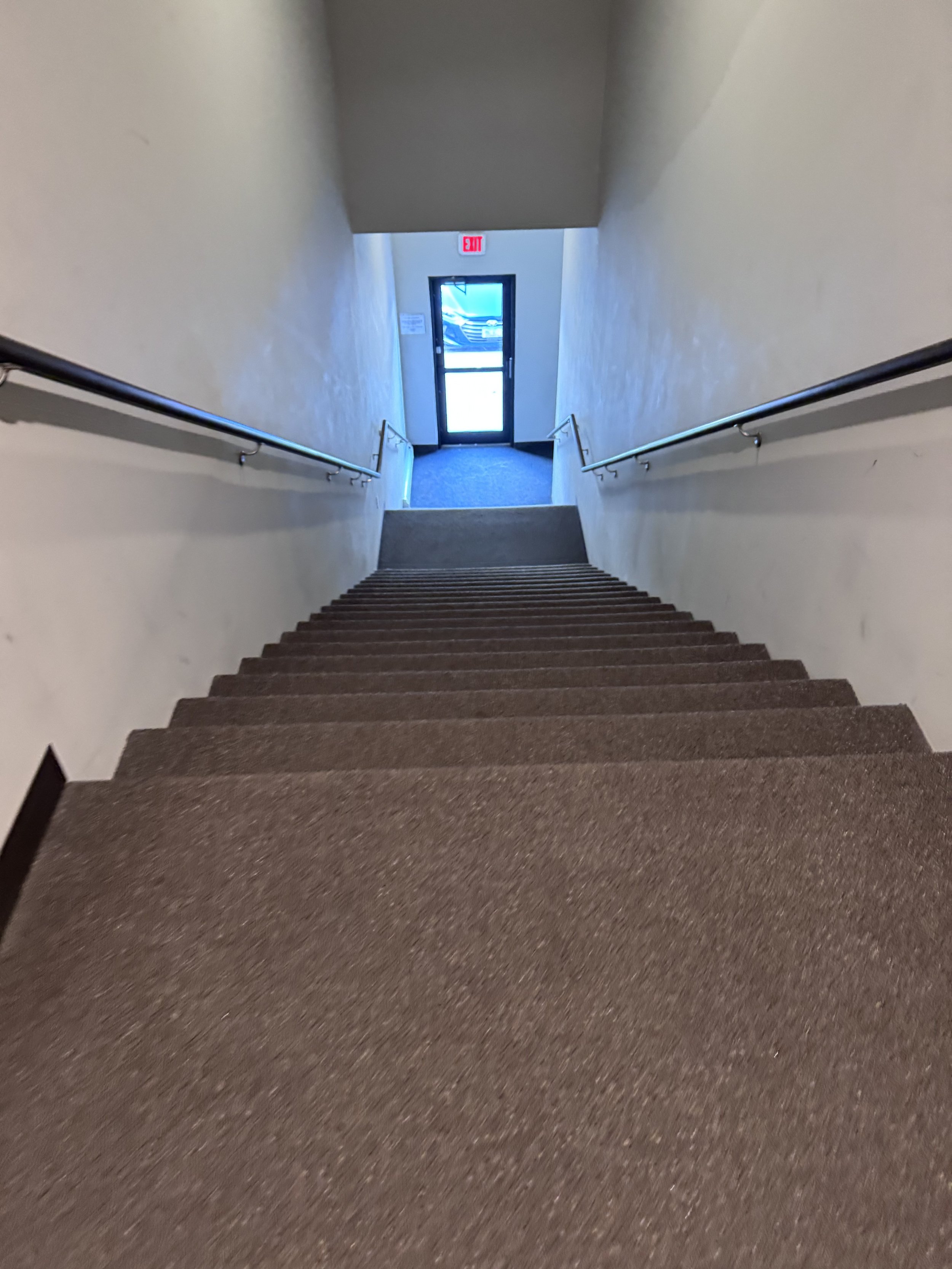 Freshly vacuumed stairwell in a commercial building serviced by Fuentes Service Providers