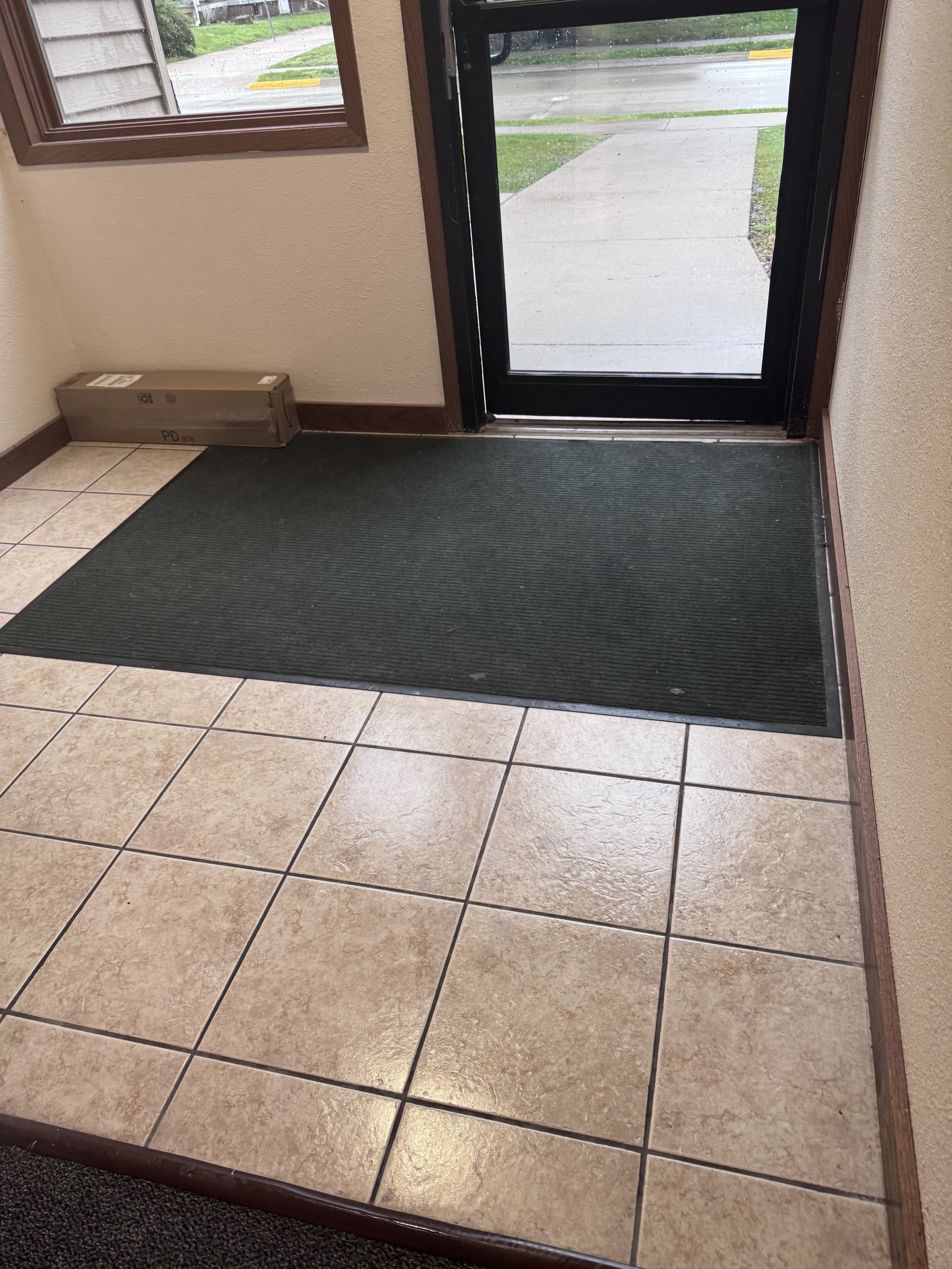 Spotless tiled entryway cleaned by Fuentes Service Providers
