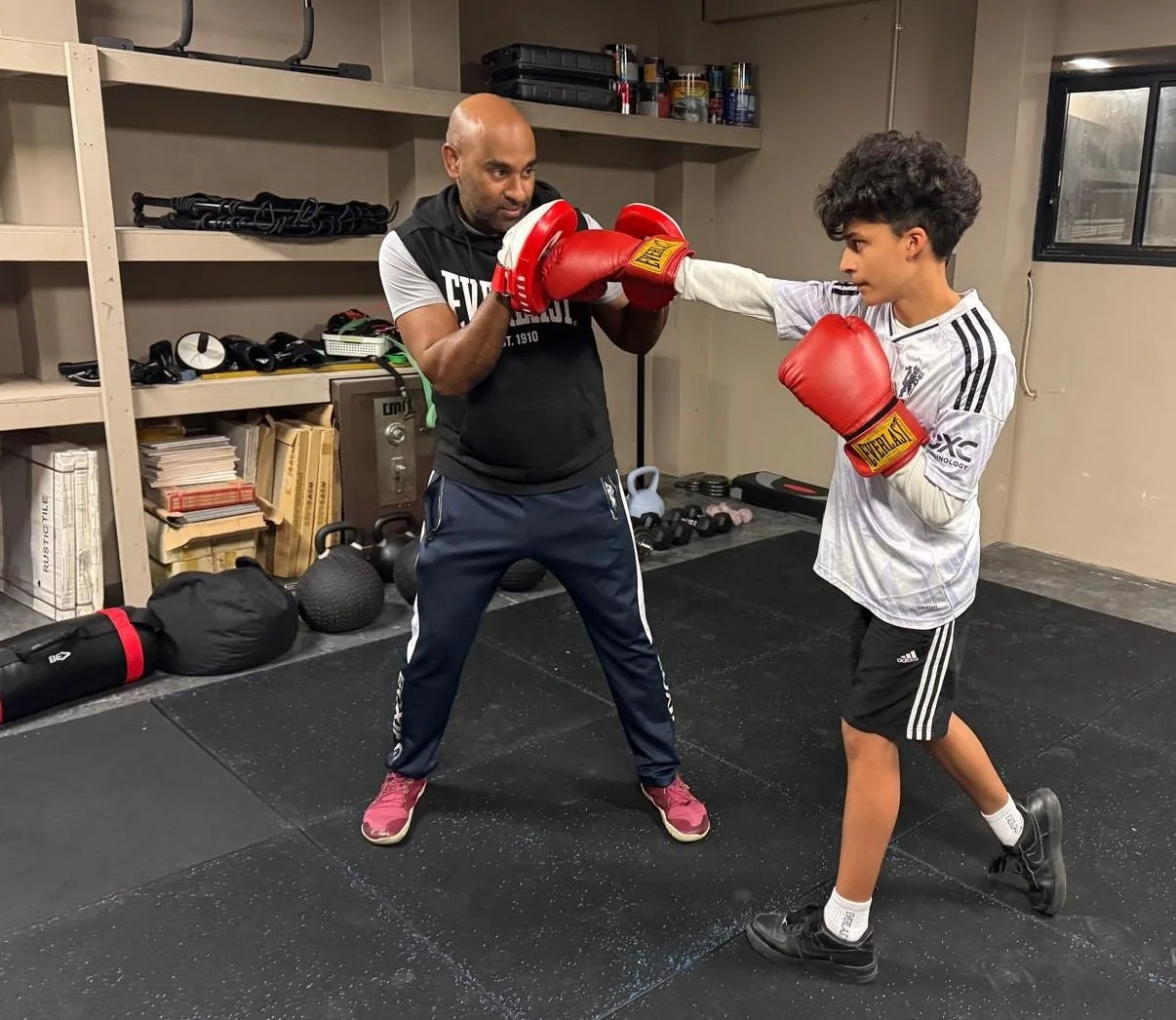 Two boxers practising boxing technique during a training session