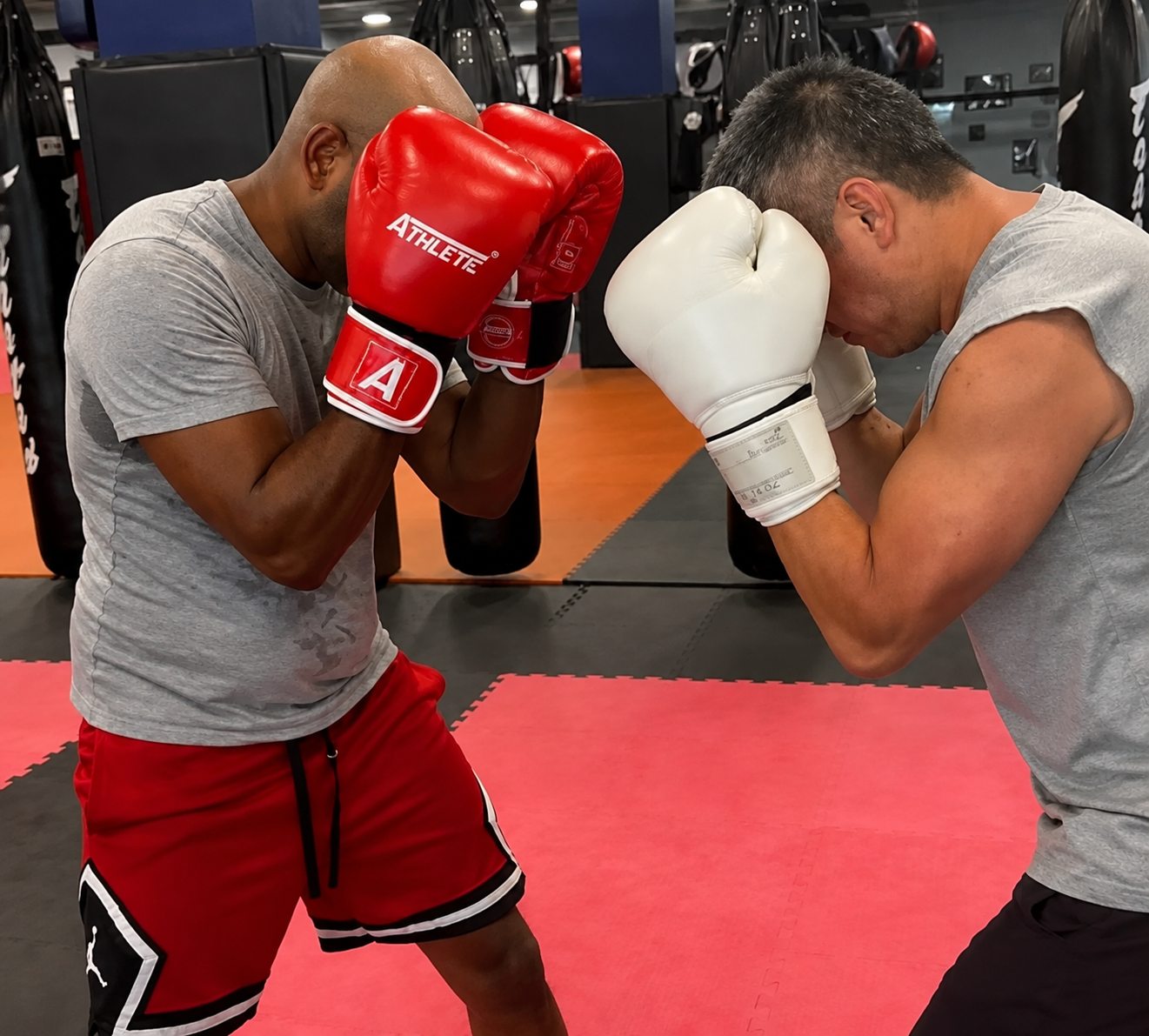 Boxers practising guard positioning and close-range boxing technique