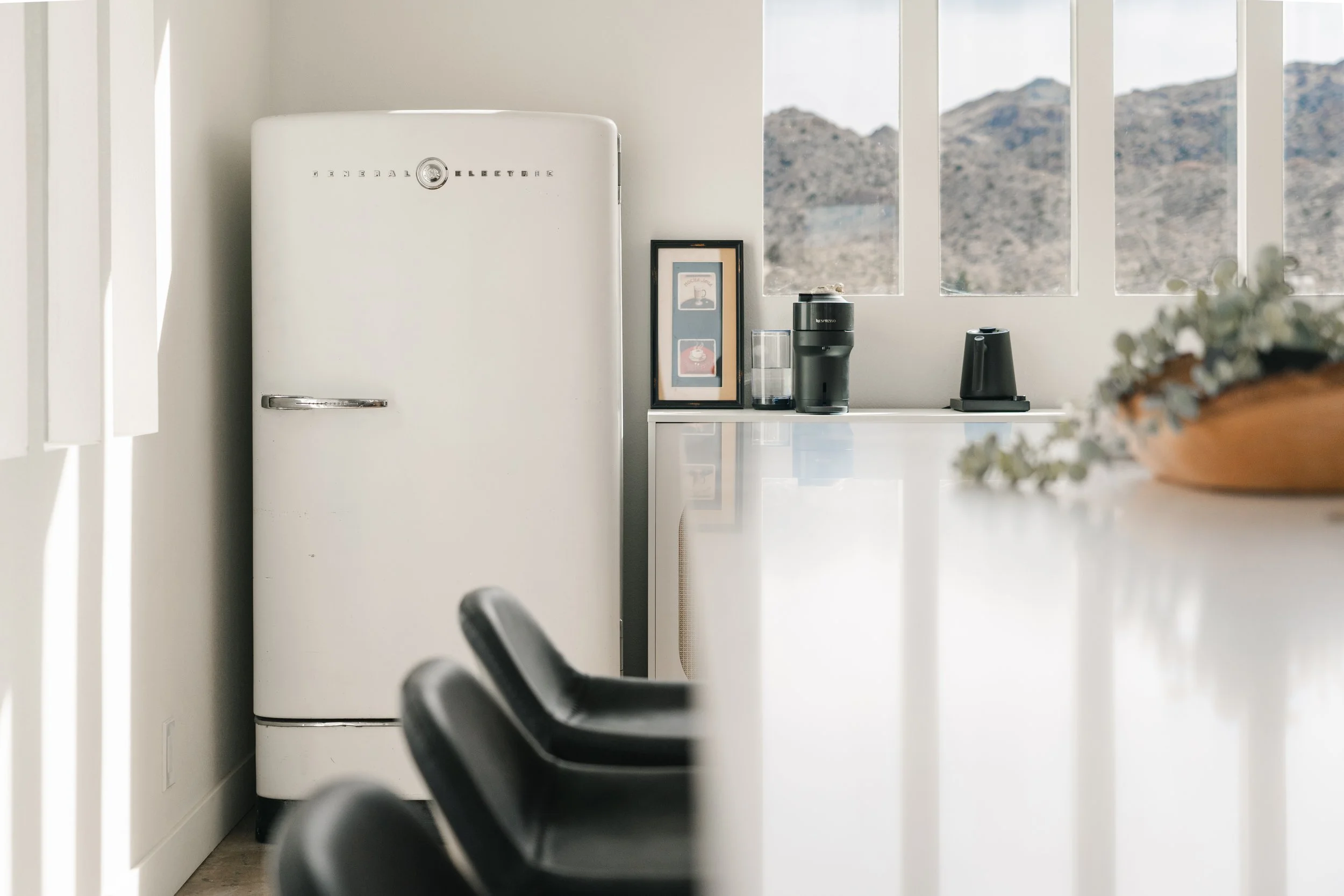 Our vintage fridge and coffee area with Nespresso, French Press, burr coffee grinder, gooseneck kettle and tea selection.