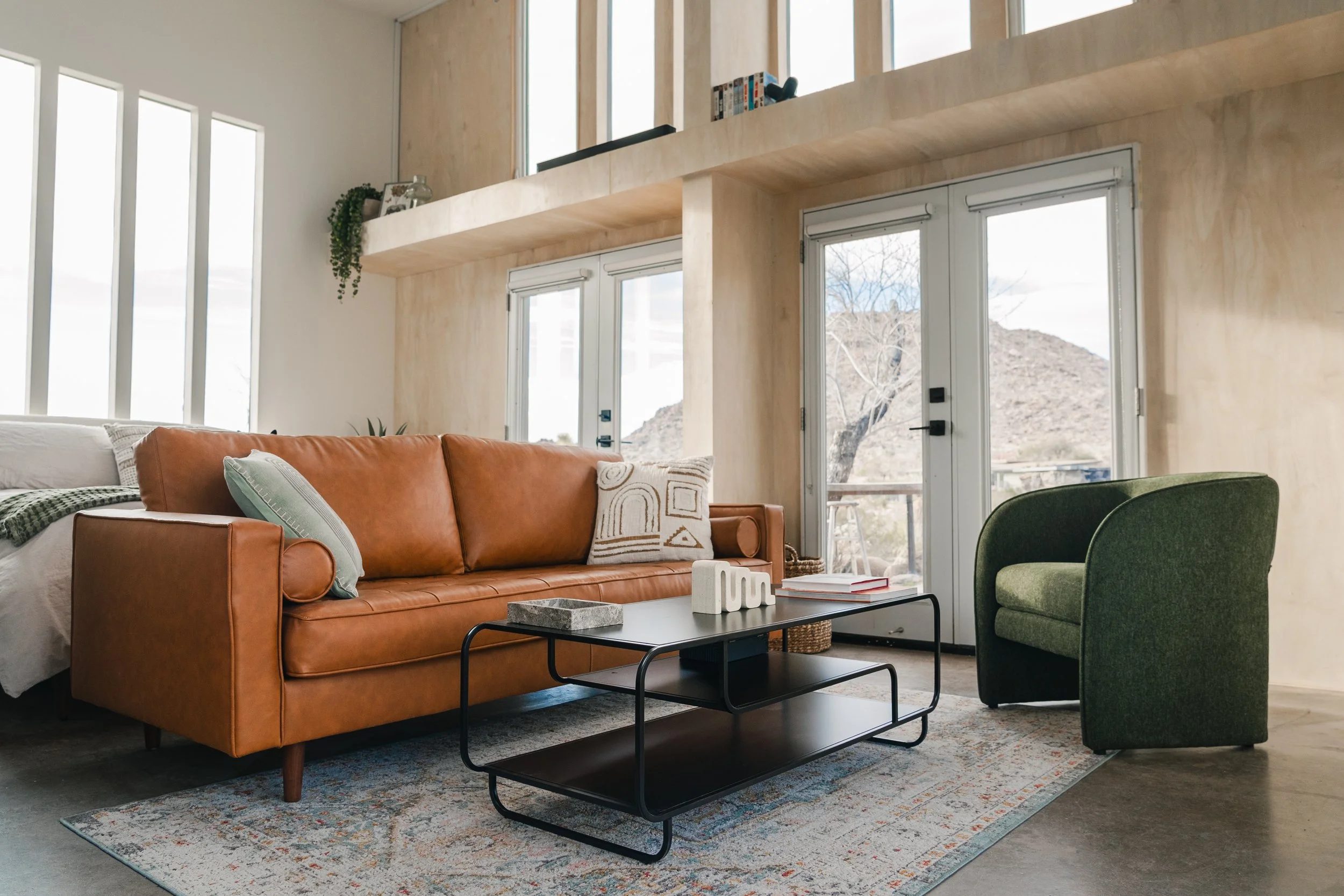 Relax in the cozy seating area of the sun-soaked living room.