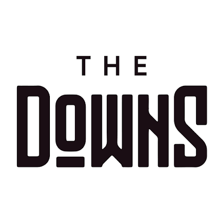 The logo for The Downs, featuring the words 'The Downs' in bold black letters with a stylized 'D' and 'S'.