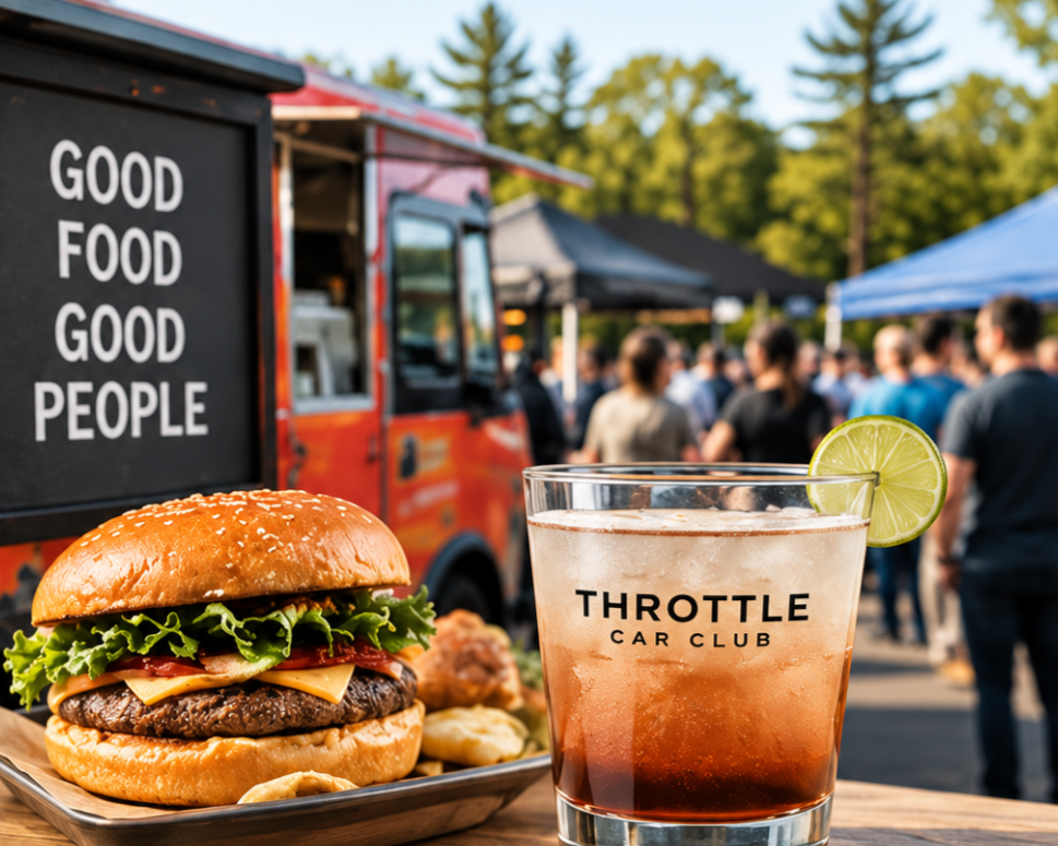 Food truck at an outdoor event with a sign that reads, "Good Food Good People." In the foreground, a cheeseburger with lettuce, tomato, cheese, and a sesame bun, along with a side of fries or potato chips. Next to it, a drink with a lemon wedge, labeled "Throttle Car Club," garnished with a lime slice. People are gathered in the background, and there are trees and tents visible.
