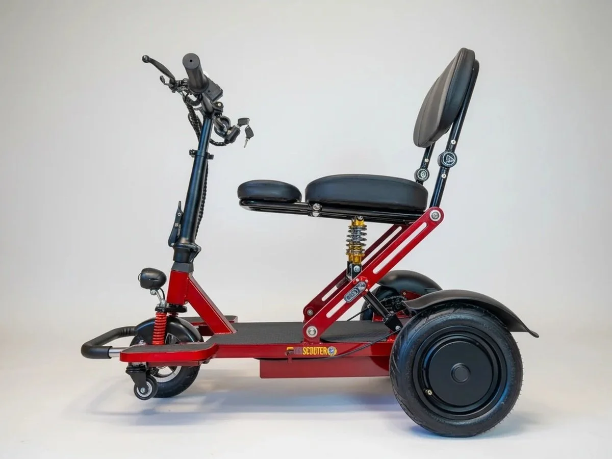 Red and black electric scooter with a seat, backrest, and front handlebar, set against a plain white background.