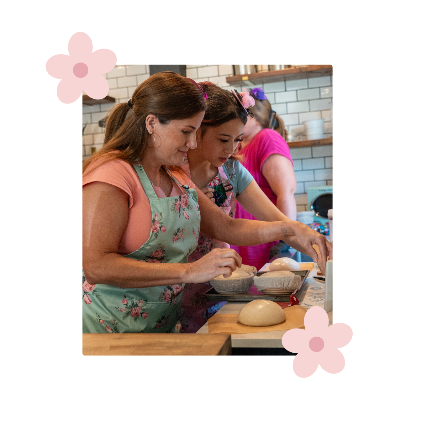 Women prepare sourdough together during a hands-on baking workshop.