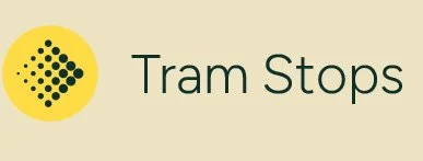 Sign reading 'Tram Stops' with a yellow circle containing black dots to the left.