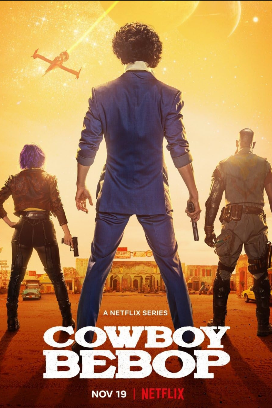 Poster for the Netflix series "Cowboy Bebop" showing three characters standing with their backs to the viewer, holding guns, with a yellow-orange sunset, a spaceship, and a small town skyline in the background.