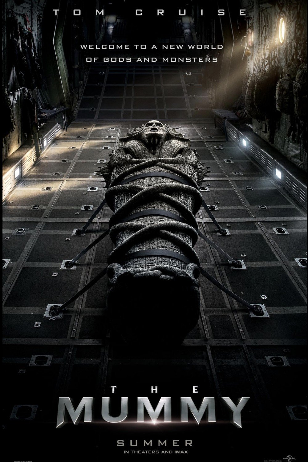 Poster for the movie 'The Mummy' featuring a large sarcophagus with a mummy's face at the top, set inside a dark, futuristic, and ominous environment with the tagline 'Welcome to a new world of gods and monsters'.