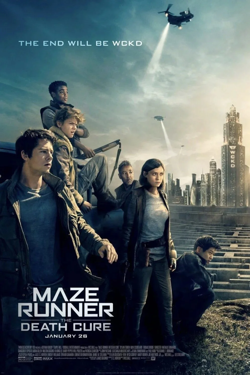 Poster for the movie "Maze Runner: The Death Cure" featuring five characters in a dystopian cityscape with futuristic buildings, helicopters, and aircraft flying in the sky. The tagline reads "The End Will Be WCKD" and the release date is January 26.
